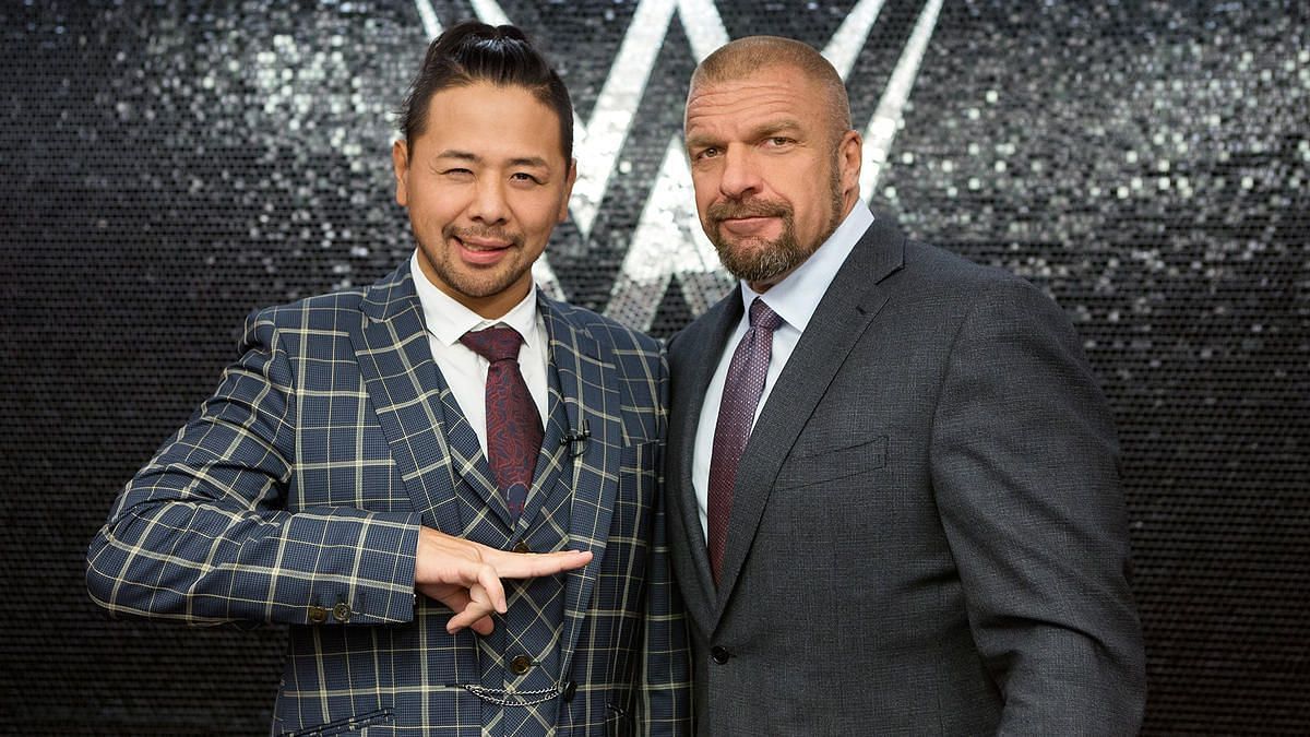 Shinsuke Nakamura (left) and WWE Chief Content Officer Triple H (right)