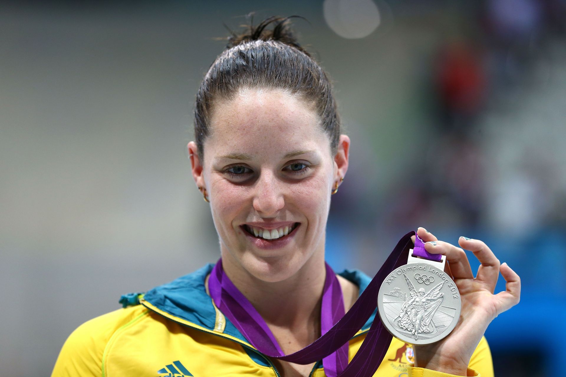 Silver medallist Alicia Coutts poses following the medal ceremony in the Women's 200m Individual Medley at the London 2012 Olympic Games 