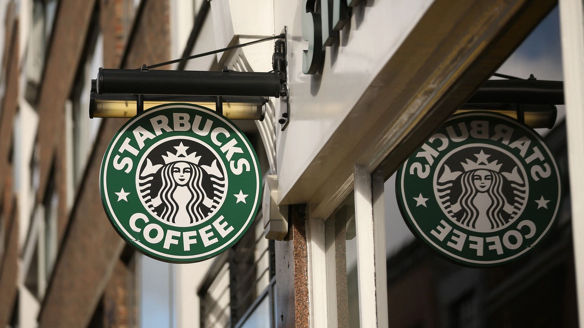 Starbucks revamps its rewards program, making redeemable coffee and snacks require more stars (Image via Oli Scarff/Getty Images)