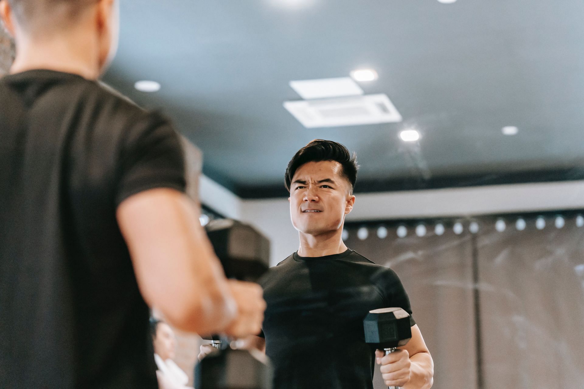 Hammer concentration curls are a good variation to try (Image via Pexels @Andres Ayrton)