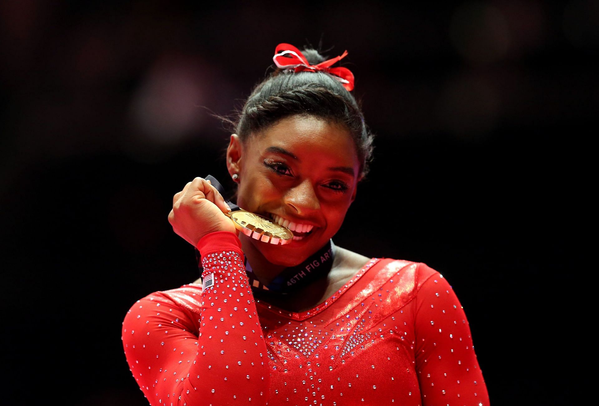 Biles poses with the Gold medal after winning the All-Around Final at the 2015 World Artistic Gymnastics Championships