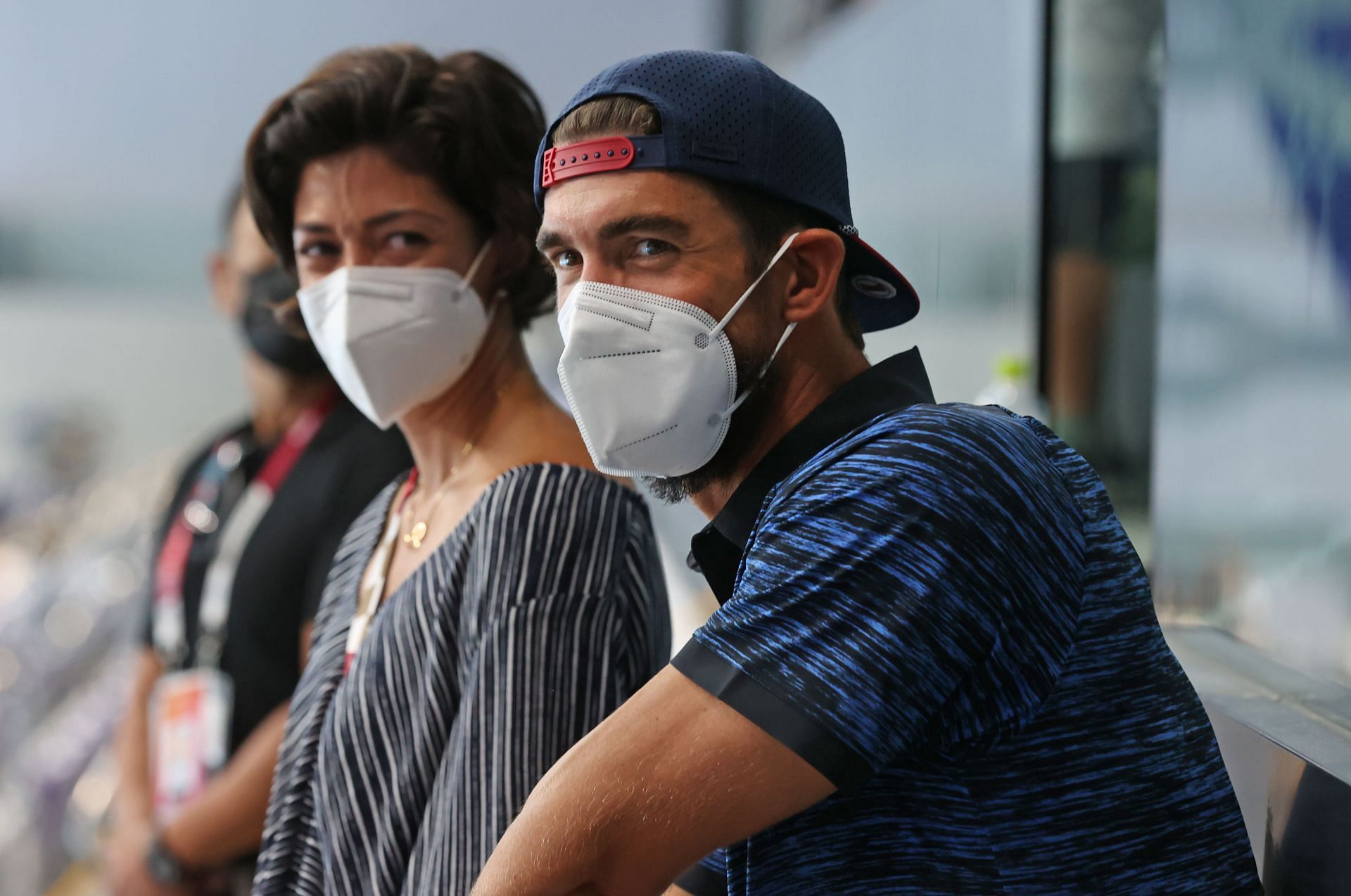 Michael Phelps and his wife Nicole Phelps look-on at the Tokyo 2020 Olympic Games (Photo by Alexander Hassenstein/Getty Images)