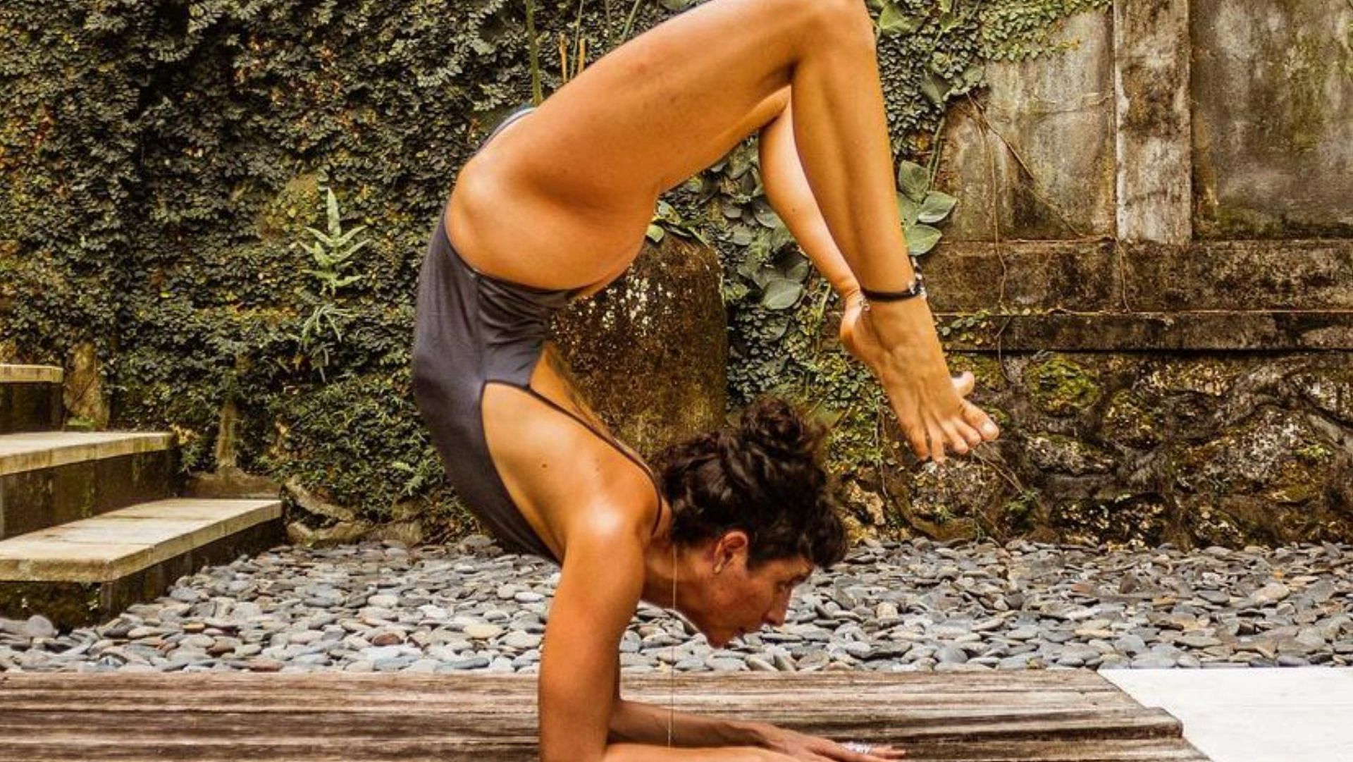 To perform the scorpion pose, build up your strength and balance. (Photo via Instagram/litasattva)