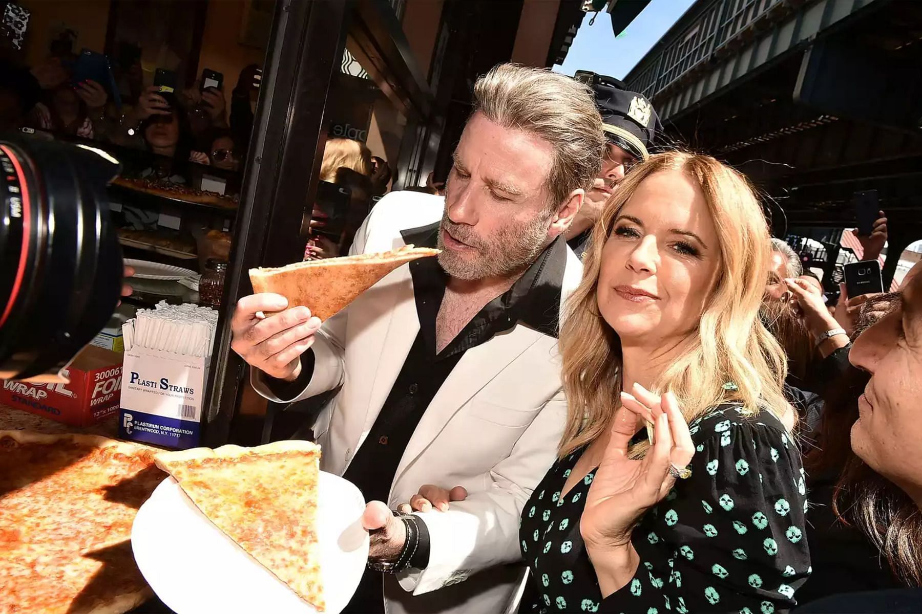 John Travolta with his wife Kelly Preston at Lenny&#039;s Pizza in June 2018 (Image via Getty Images)