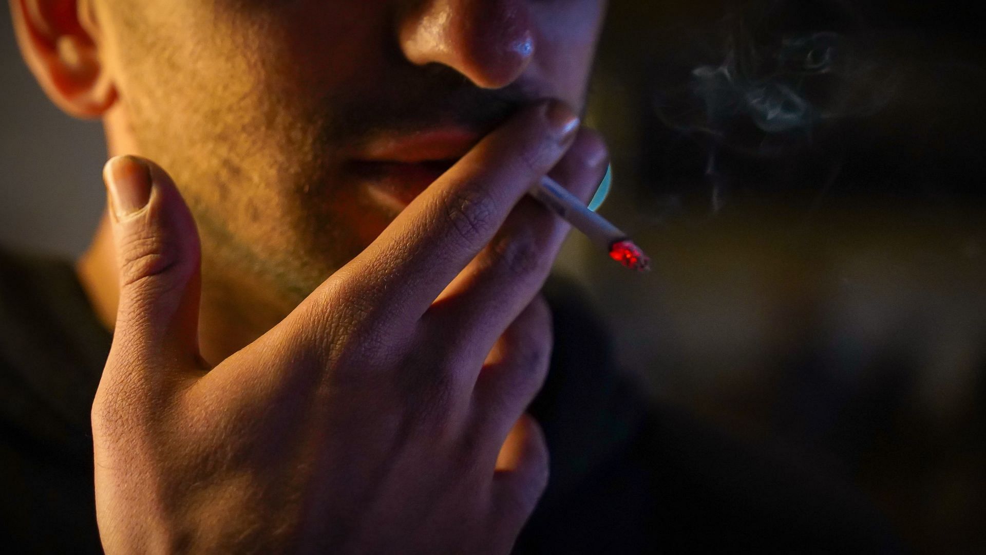 Smoking can cause severe ear congestion. (Image via Unsplash/Reza Mehrad)