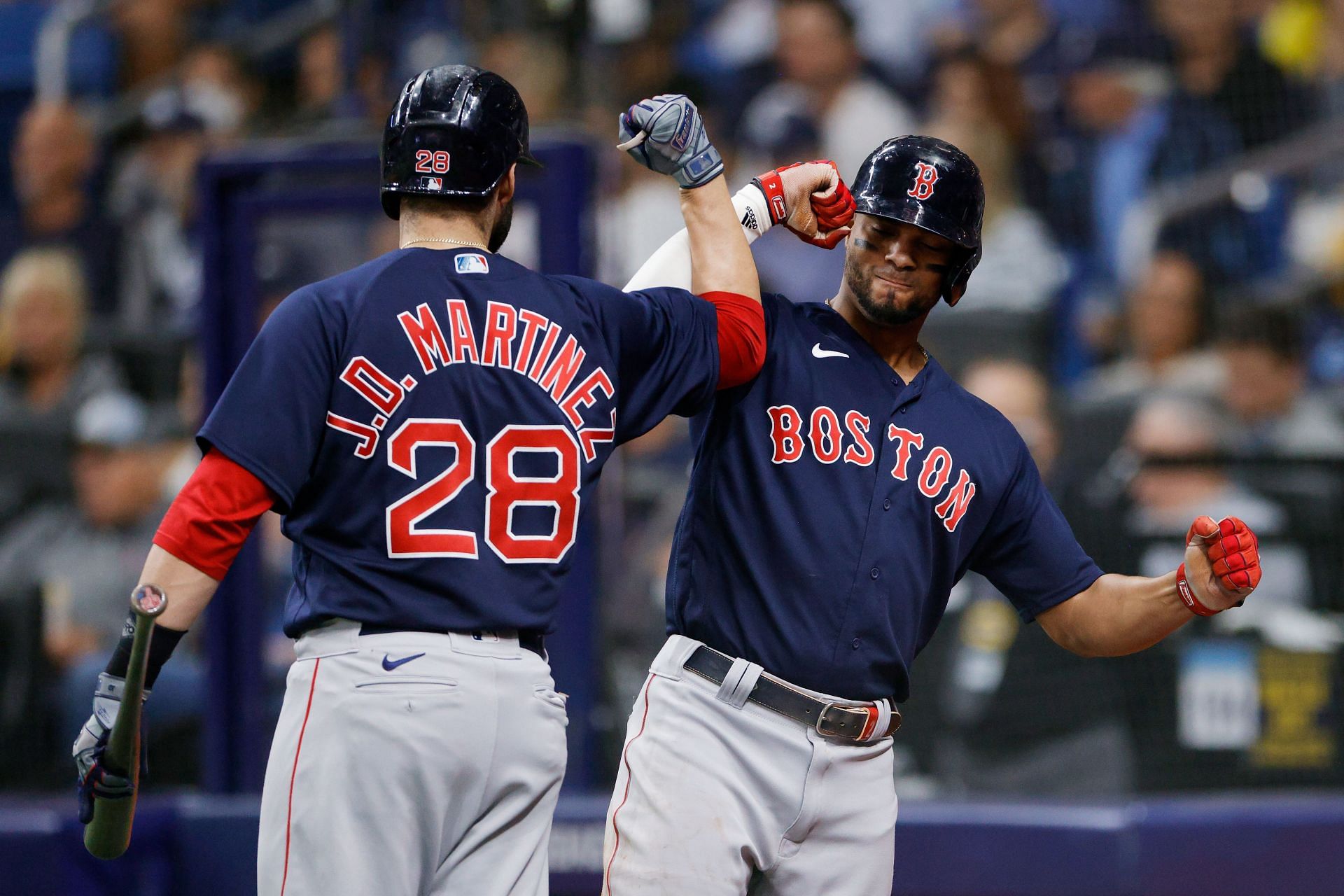 Xander Bogaerts celebrates his solo homerun with J.D. Martinez against the Tampa Bay Rays at Tropicana Field