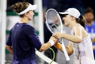 Barbora Krejcikova and Iga Swiatek greet each other after their 2023 Dubai Tennis Championships final.