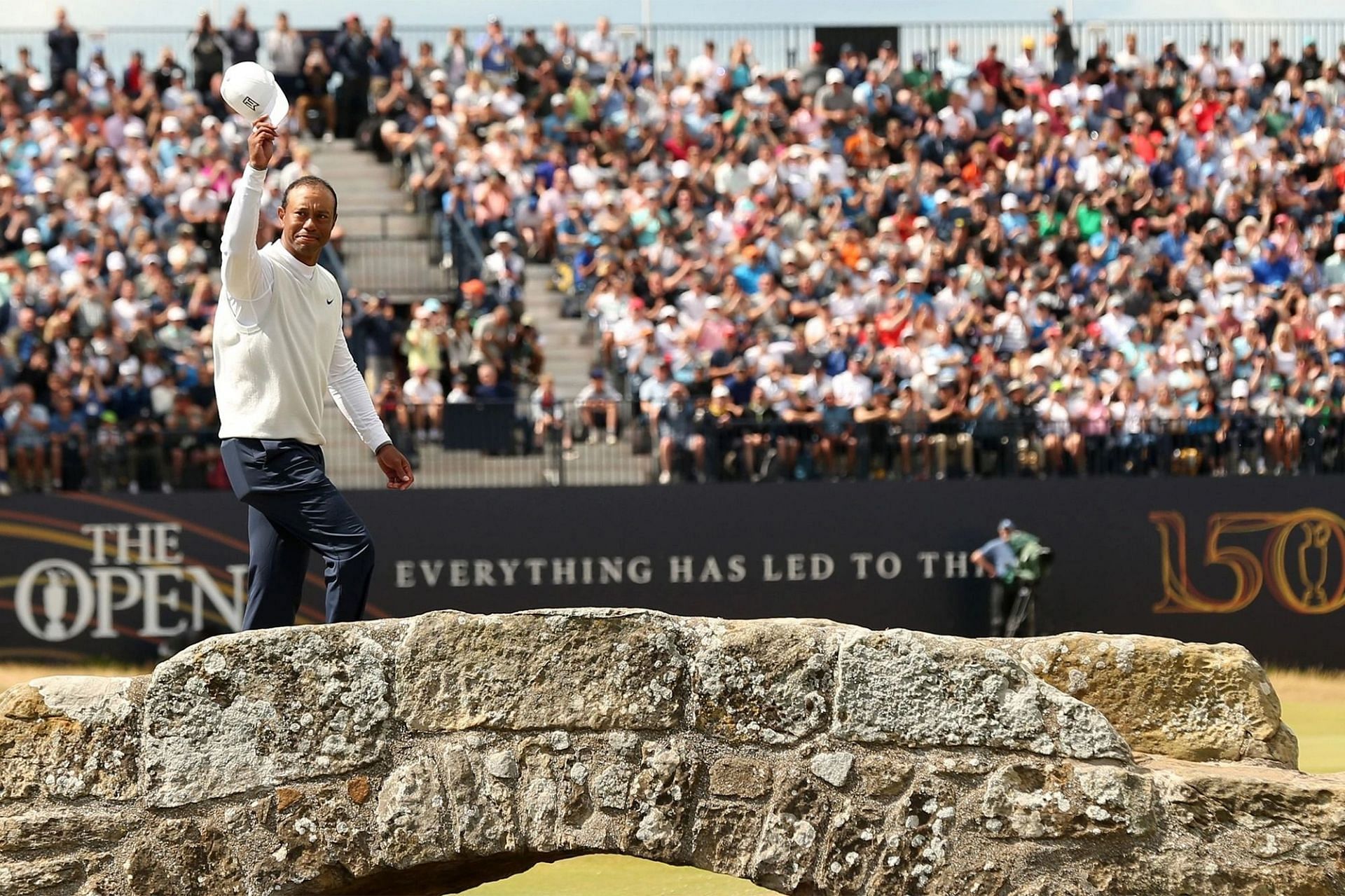 Tiger Woods waving to the fans during 150th Open at history Swilcan Bridge