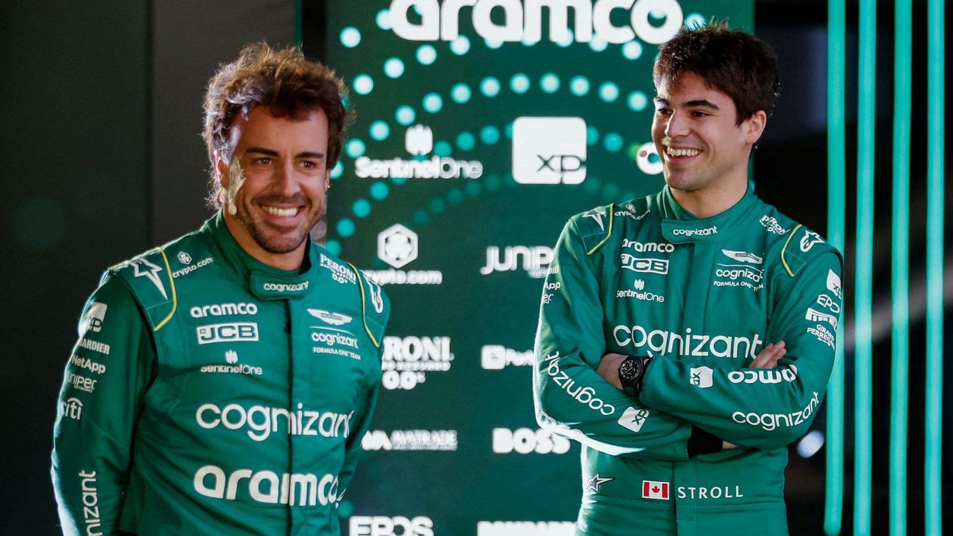 Fernando Alonso (Left) and Lance Stroll (Right) during the 2023 Aston Martin AM23 car launch (Image via Twitter / @AstonMartinF1) 