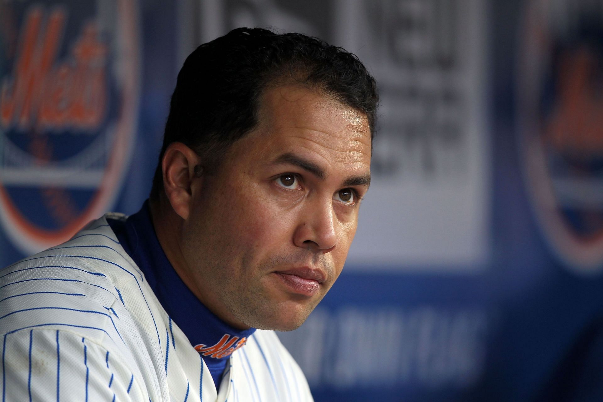 Carlos Beltran of the New York Mets looks on from the dugout against the Washington Nationals during the Mets&#039; Home Opener at Citi Field on April 8, 2011, in the Flushing neighborhood of Queens in New York City.