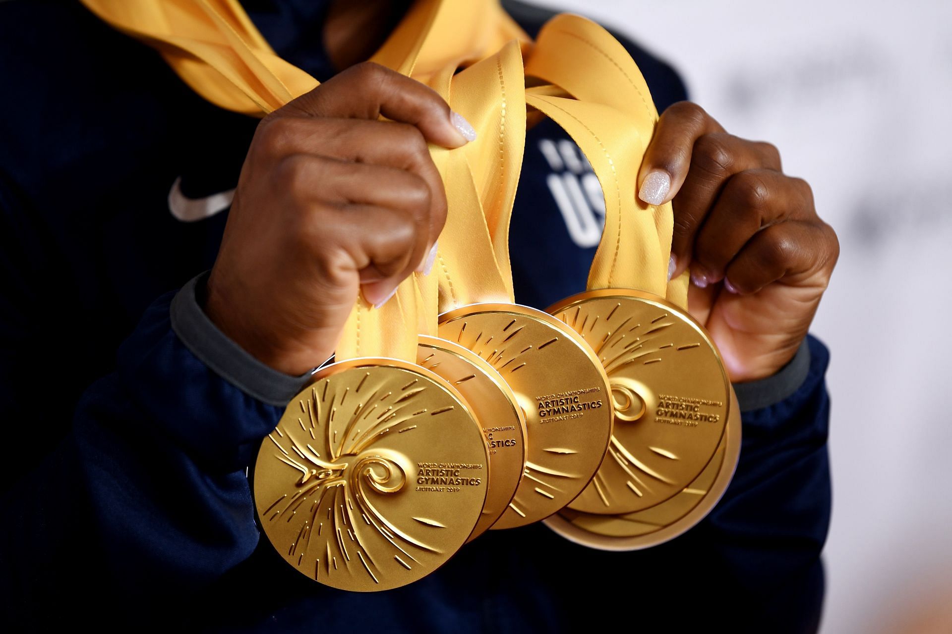 Biles with her multiple gold medals at the 49th FIG Artistic Gymnastics World Championships