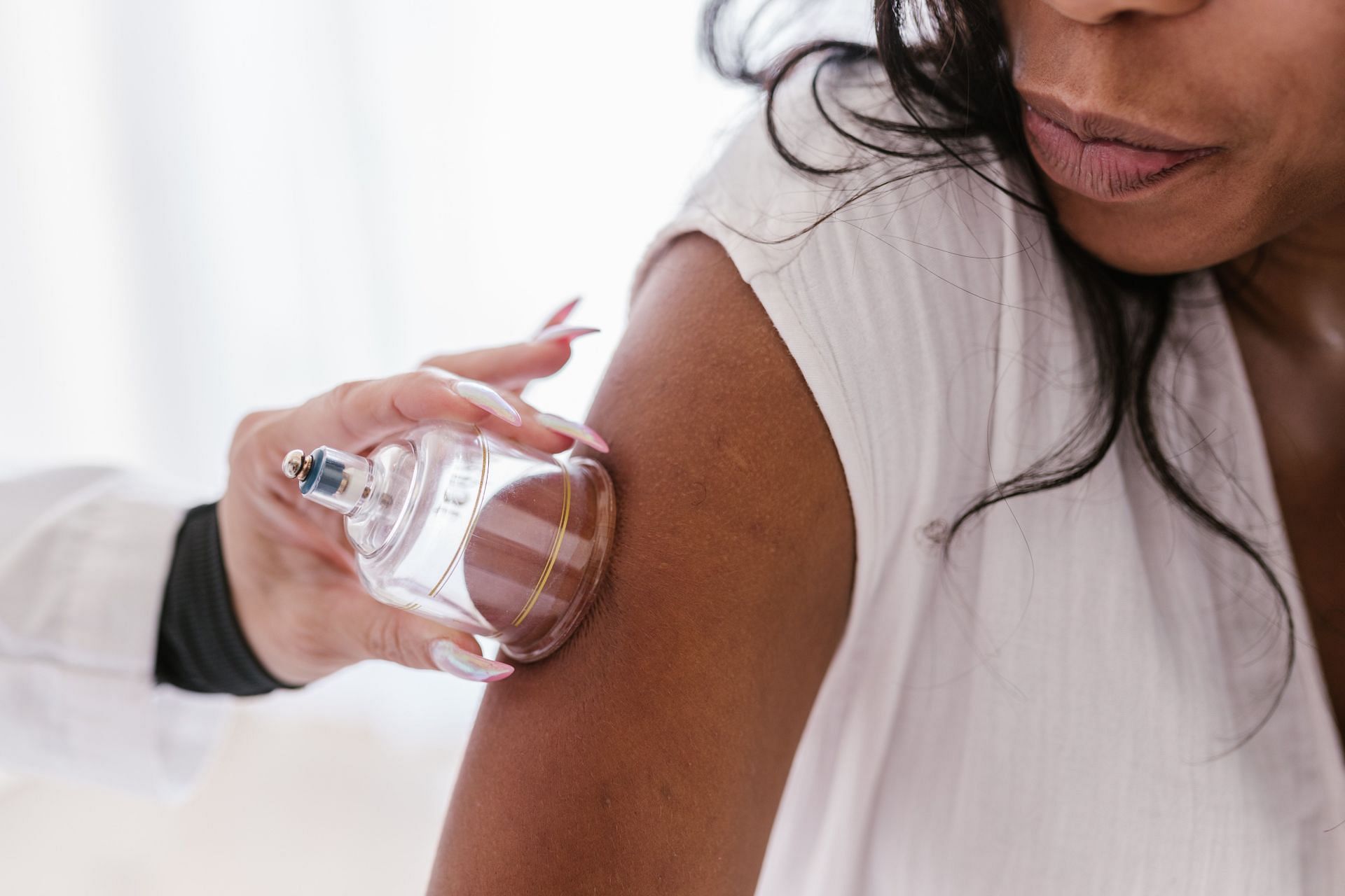 Researchers continue to investigate how cupping reduces pain and illness symptoms. (Image via Pexels/ Rodnae Productions)