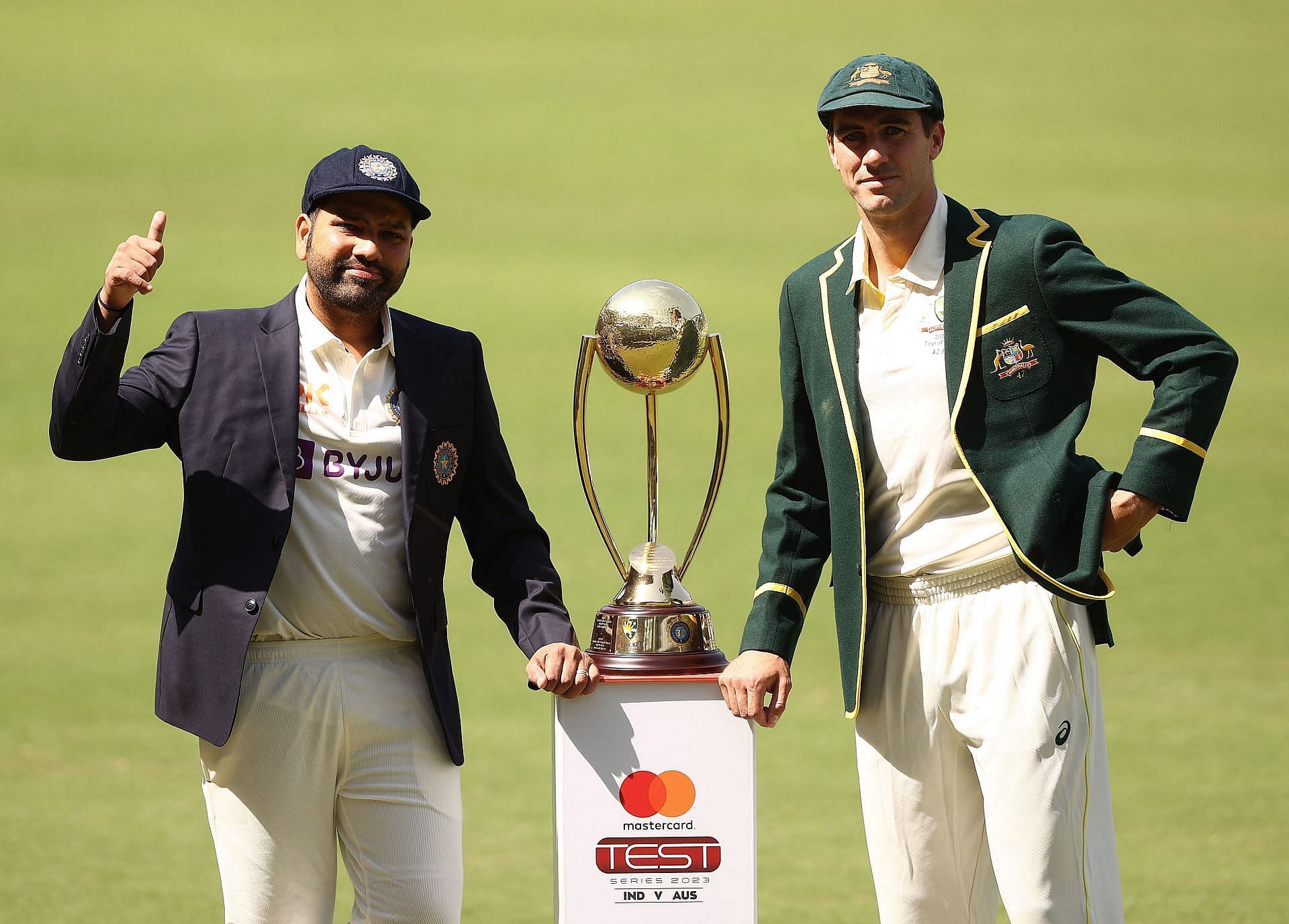 Indian captain Rohit Sharma and his Australian counterpart Pat Cummins pose with the Border-Gavaskar trophy