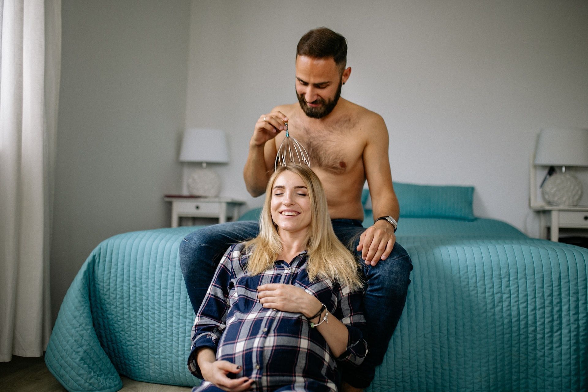 A head massage is one of the best natural remedies for headaches during pregnancy. (Photo via Pexels/Yan Krukau)