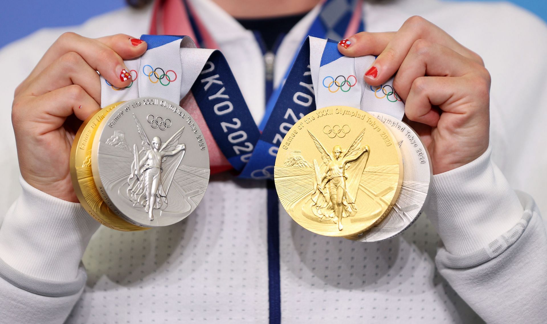 Katie Ledecky of Team USA poses with her two Gold and two Silver medals after a giving a press conference to the media during the Tokyo Olympic Games on July 31, 2021 in Tokyo, Japan. (Photo by Laurence Griffiths/Getty Images)