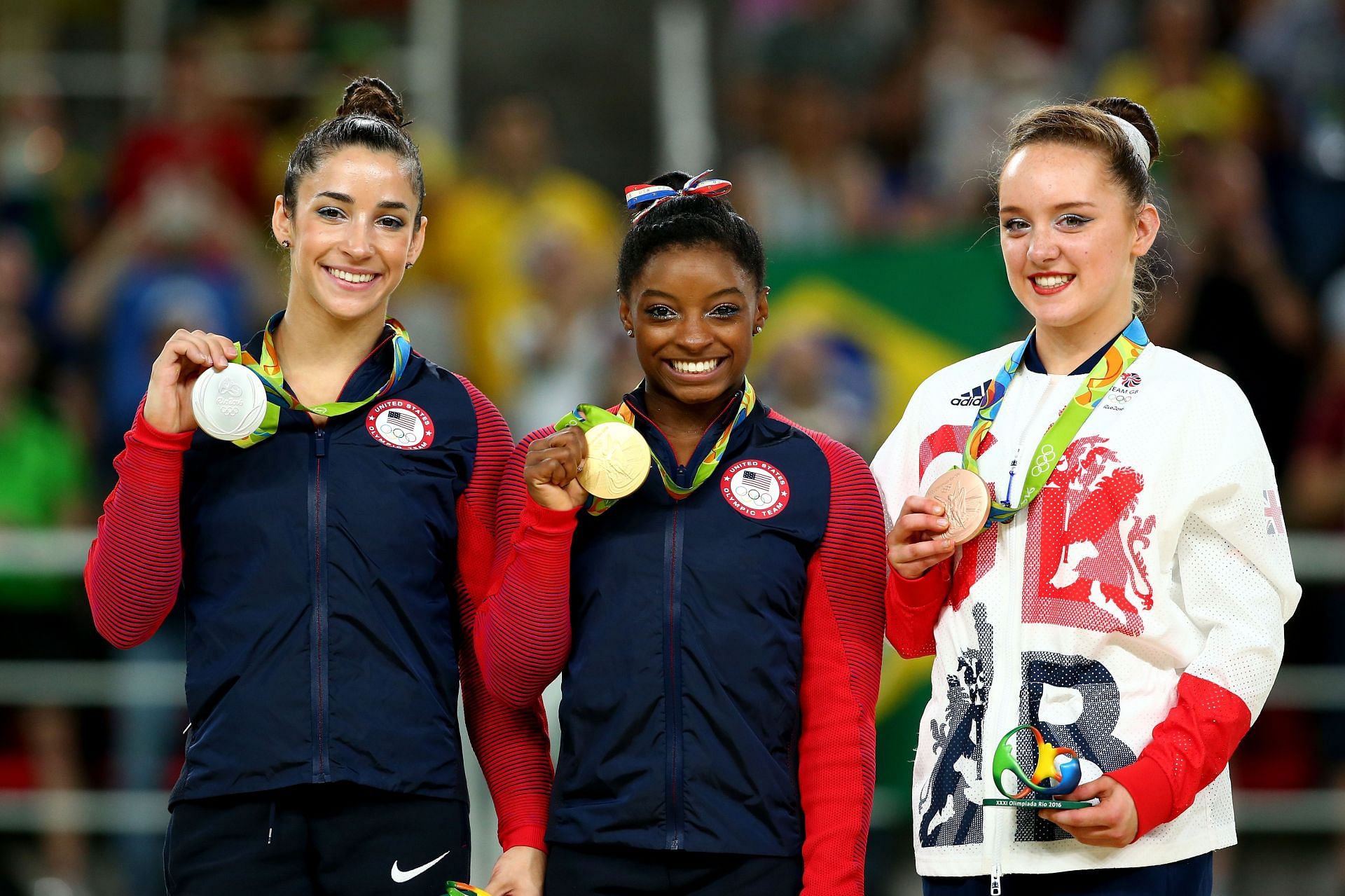 Alexandra Raisman (Silver), Simone Biles (Gold), and Amy Tinkler (Bronze) on the podium at the medal ceremony for the Women&#039;s Floor at 2016 Rio Games