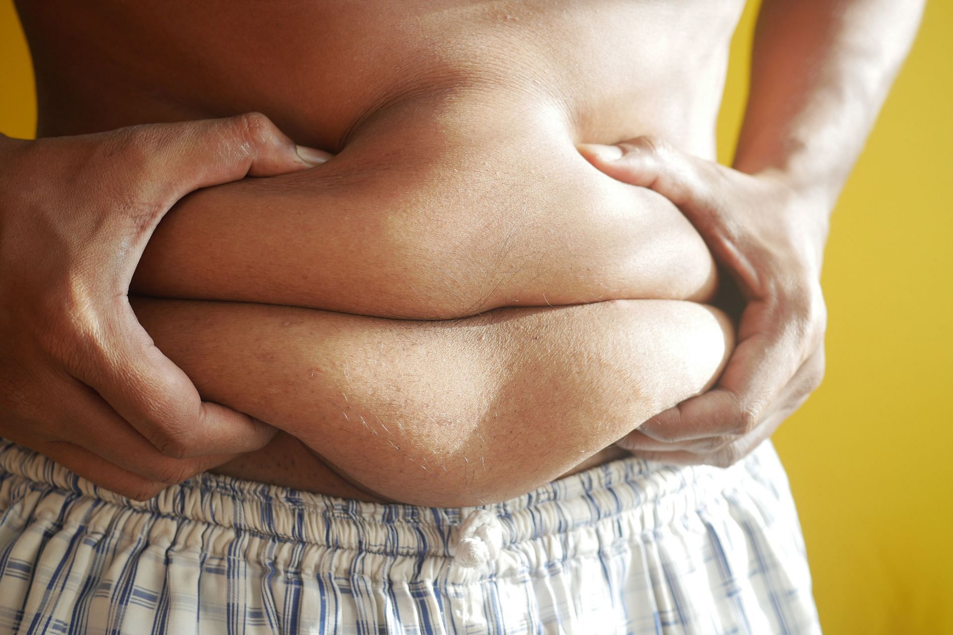 Love handles can be an indicator of excess/stubborn belly fat (Image via Pexels @Towfiqu Barbhuiya)