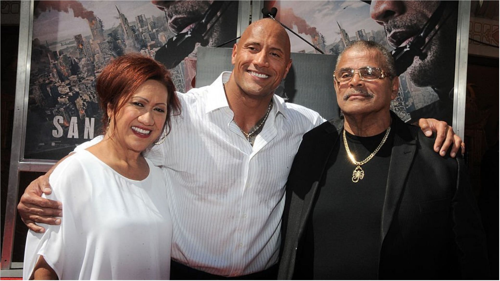 Dwayne Johnson with his parents at the Hand And Footprint Ceremony held at TCL Chinese Theatre IMAX (Image via Albert L. Ortega/Getty Images)