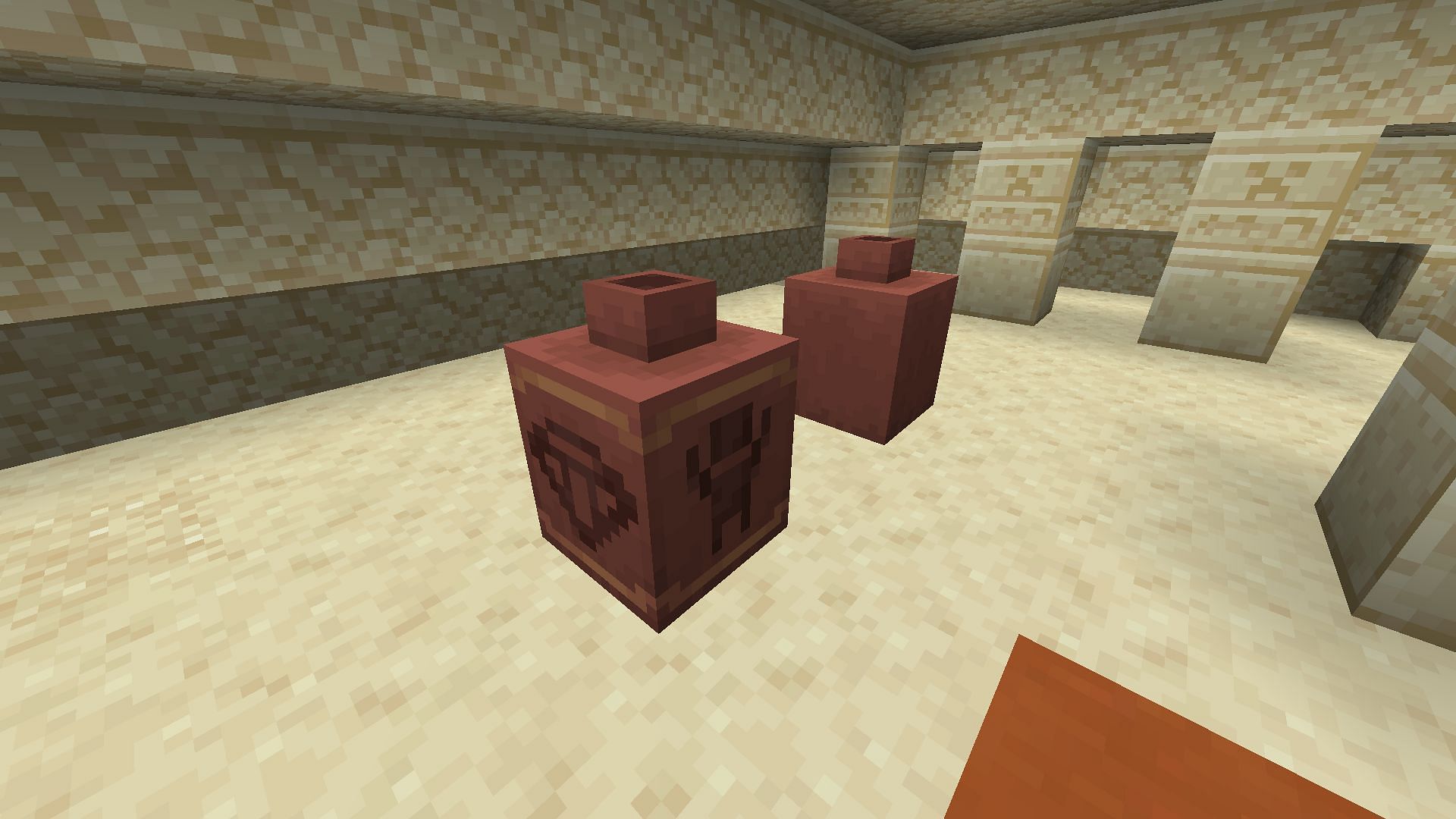 The difference between a decorated pot made from pottery shards and one made from bricks in Minecraft (Image via Mojang)