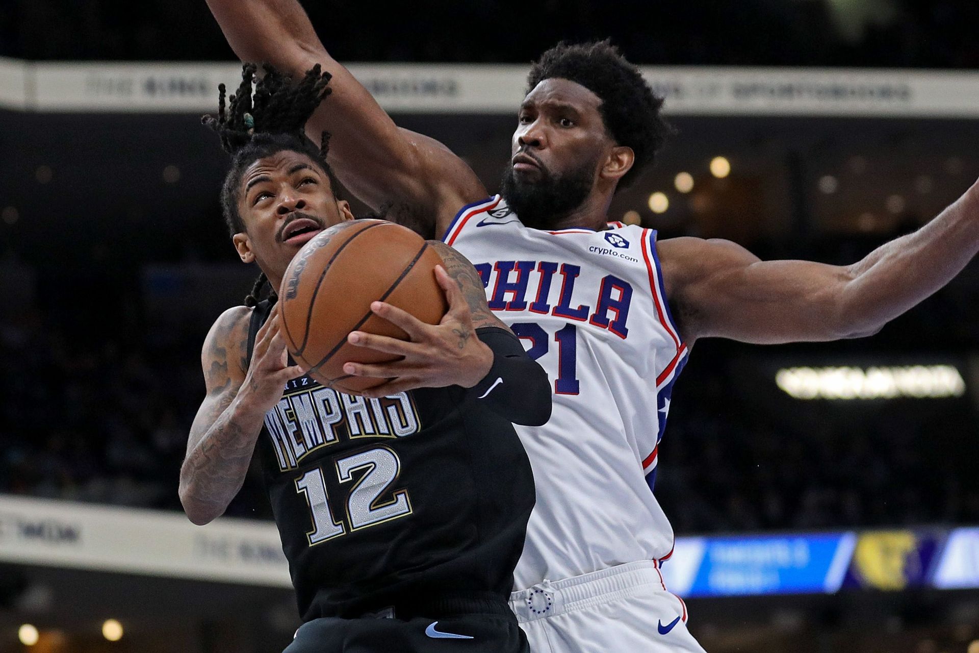 NBA stars Ja Morant (left) and Joel Embiid