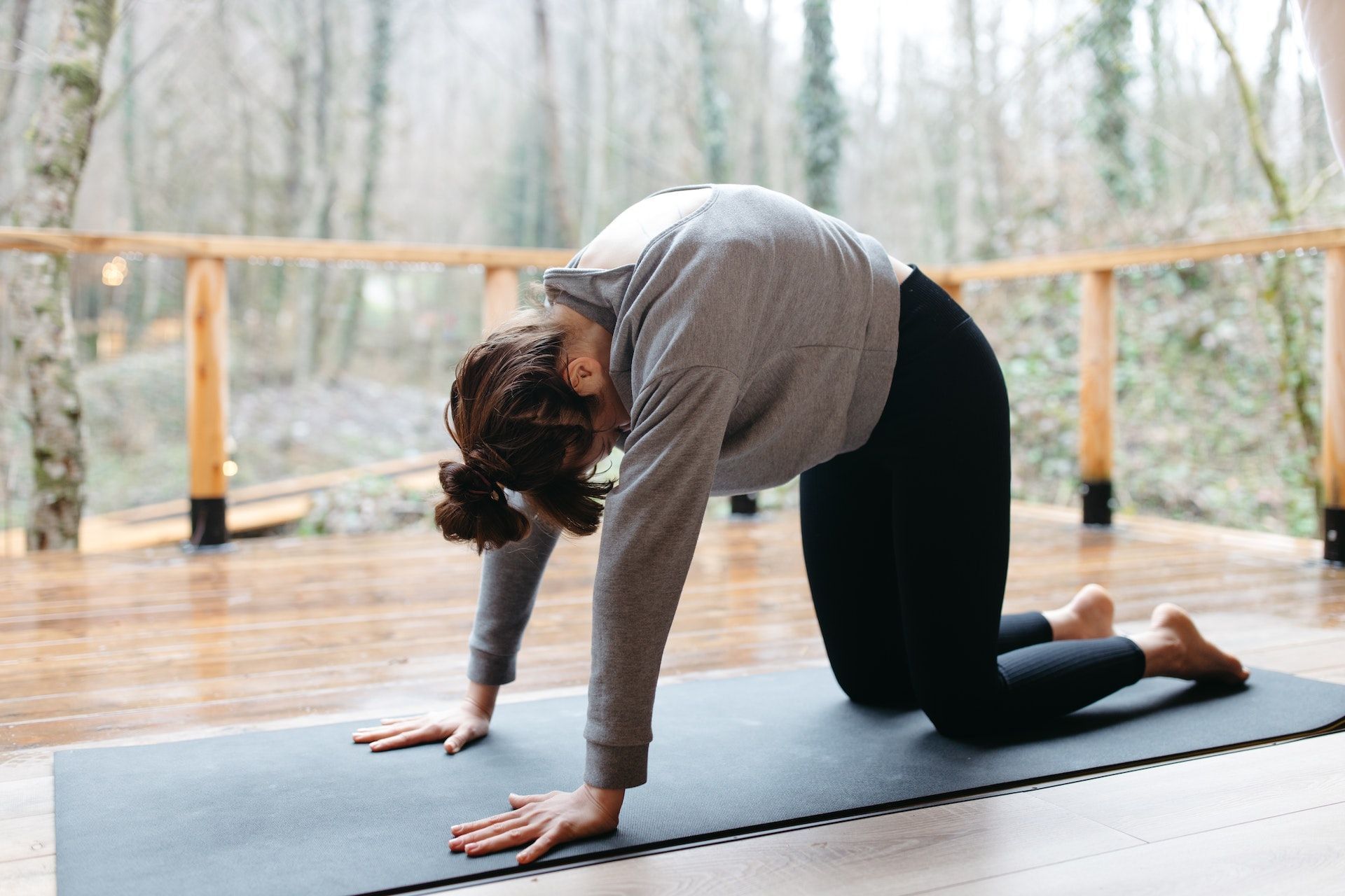 The cat-cow pose is a good exercise to get rid of hunched back. (Photo via Pexels/Anastasia Shuraeva)