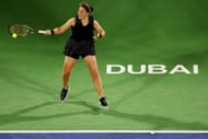 Ostapenko strikes the ball in Dubai
