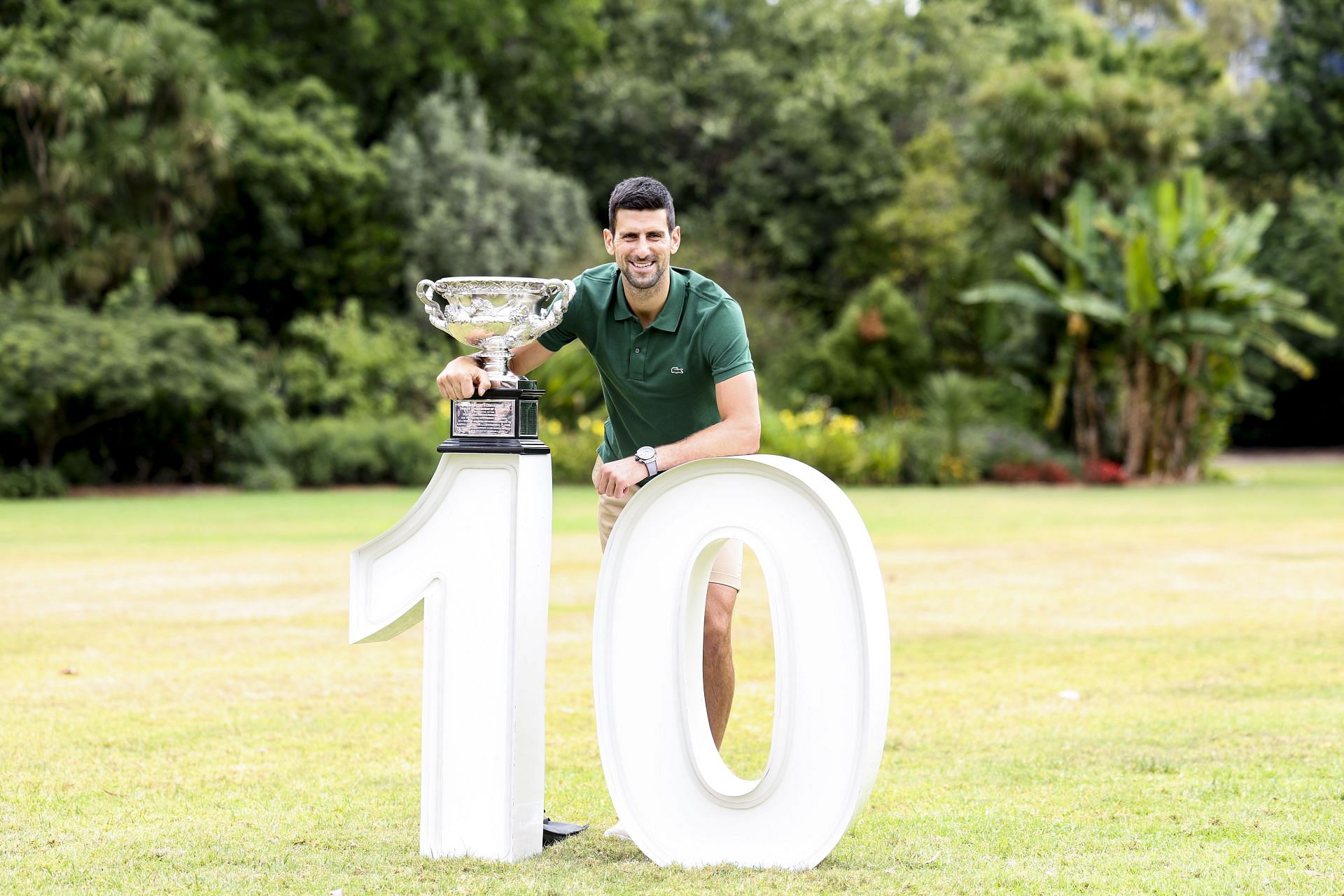 Novak Djokovic posing with the Australian Open trophy
