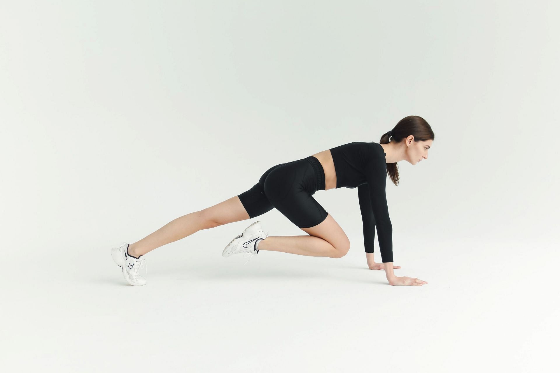 Mountain climbers are a great exercise to add to your workout for flat stomach! (Image via pexels/Polina Tankilevitch)