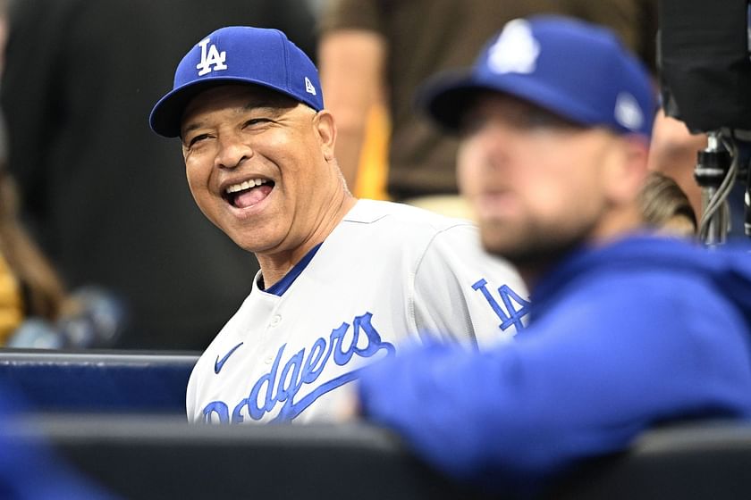 Los Angeles Dodgers' Dave Roberts walks in the dugout wearing a new Los  Dodgers uniform before a baseball game against the New York Mets in Los  Angeles, Saturday, Aug. 21, 2021. (AP