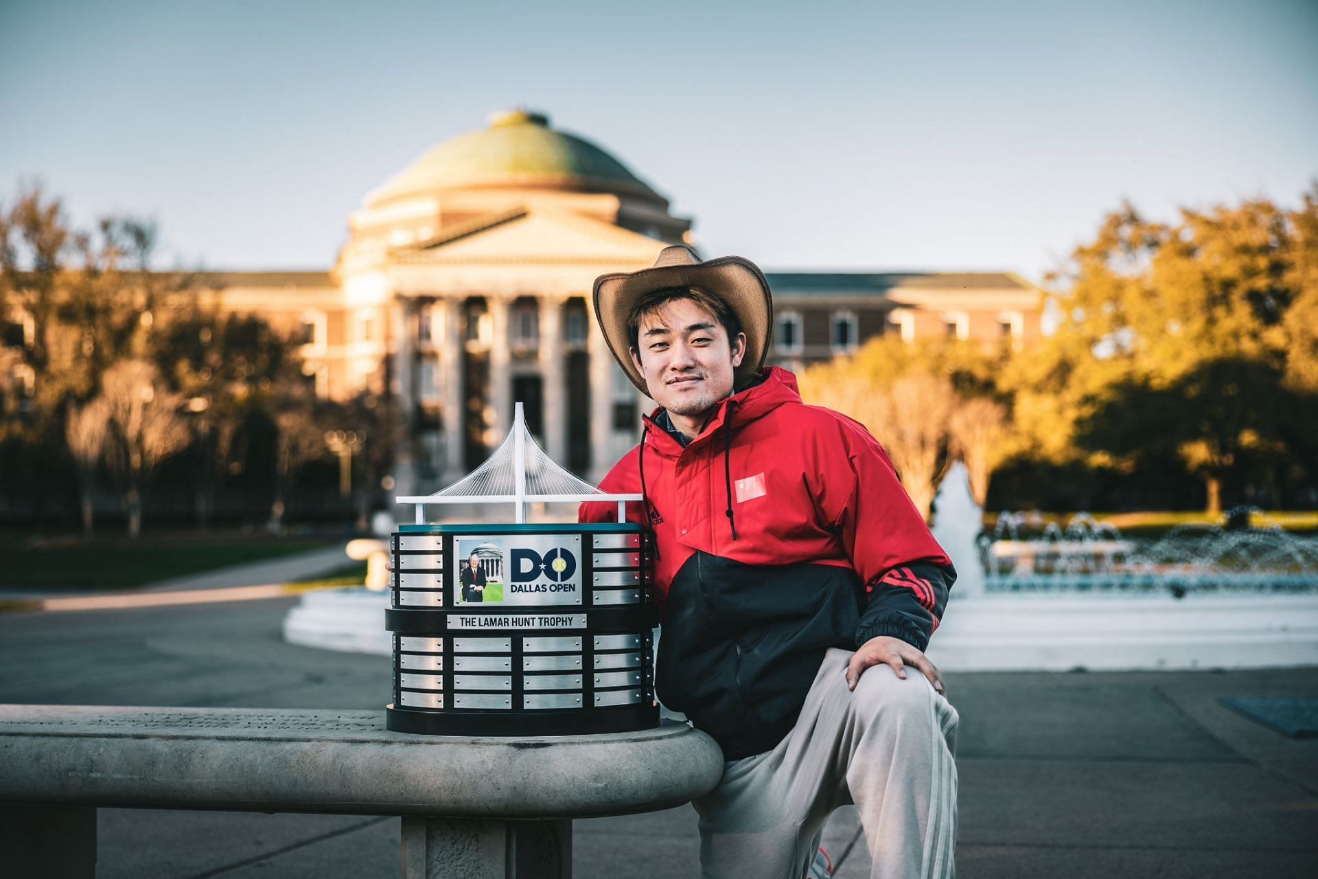 Yibing Wu poses with his Dallas Open trophy