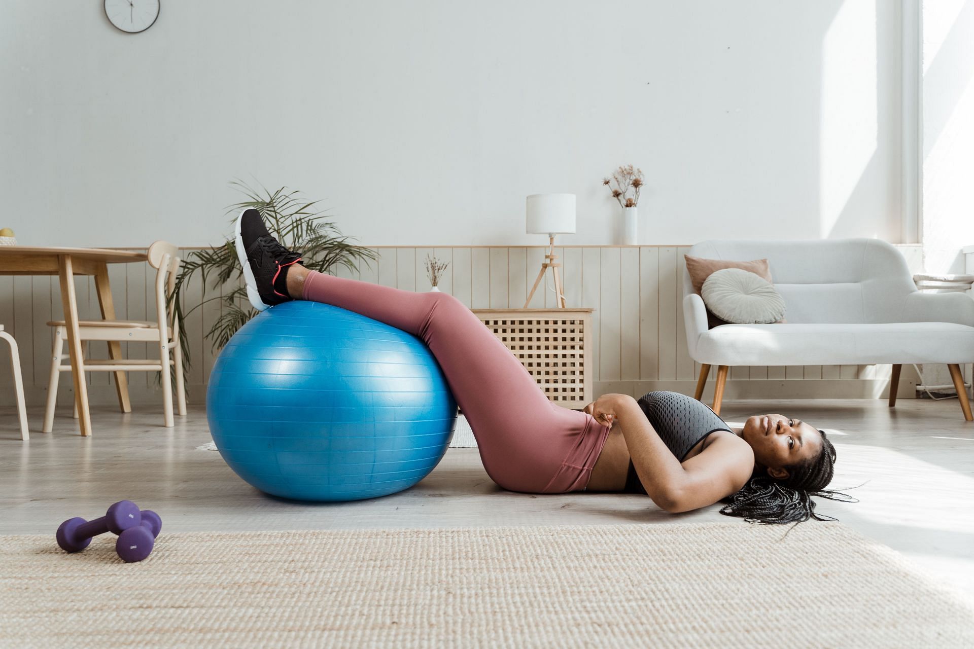 Stability ball exercise (Image via Pexels/MART Productions)