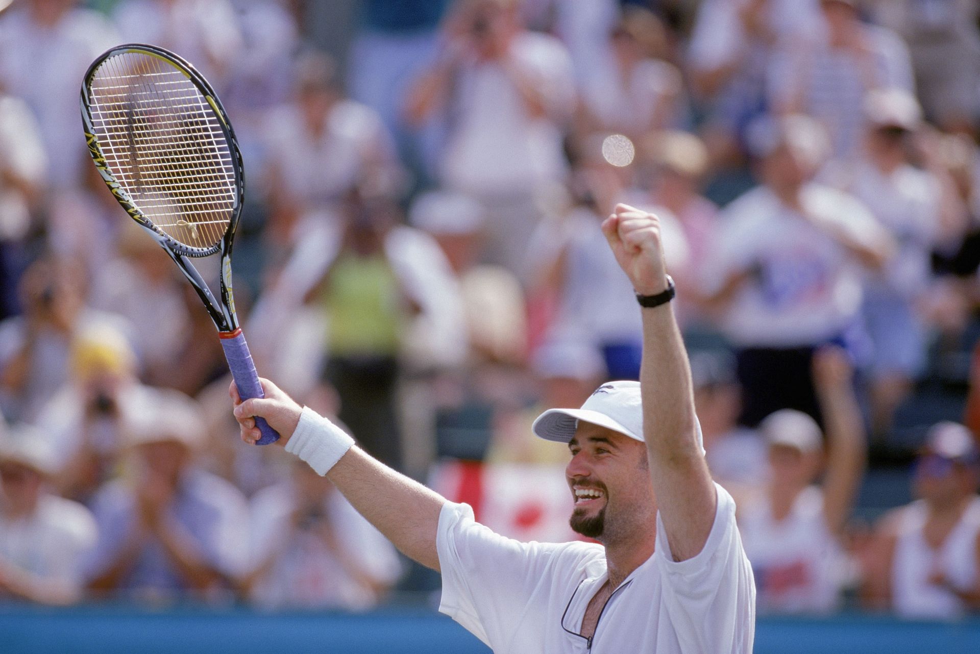 Andre Agassi celebrates the gold medal at the 1996 Olympics