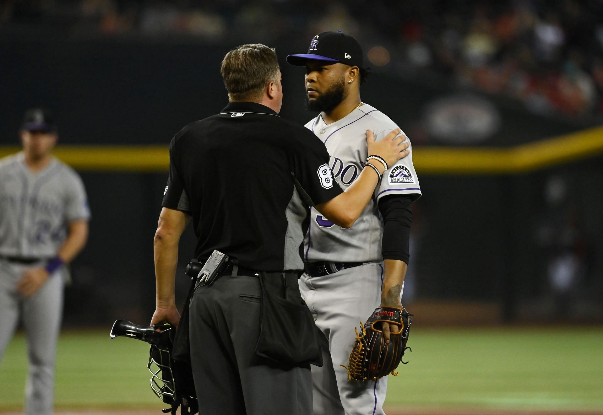 Home plate umpire Cory Blaser talks with pitcher Alex Colome of the Colorado Rockies after giving up a balk at Chase Field