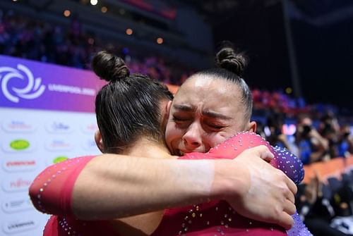 Jessica Gadirova celebrates with twin sister Jennifer Gadirova after winning a gold medal in the Women's Floor Final at the FIG Artistic Gymnastics World Championships in 2022 