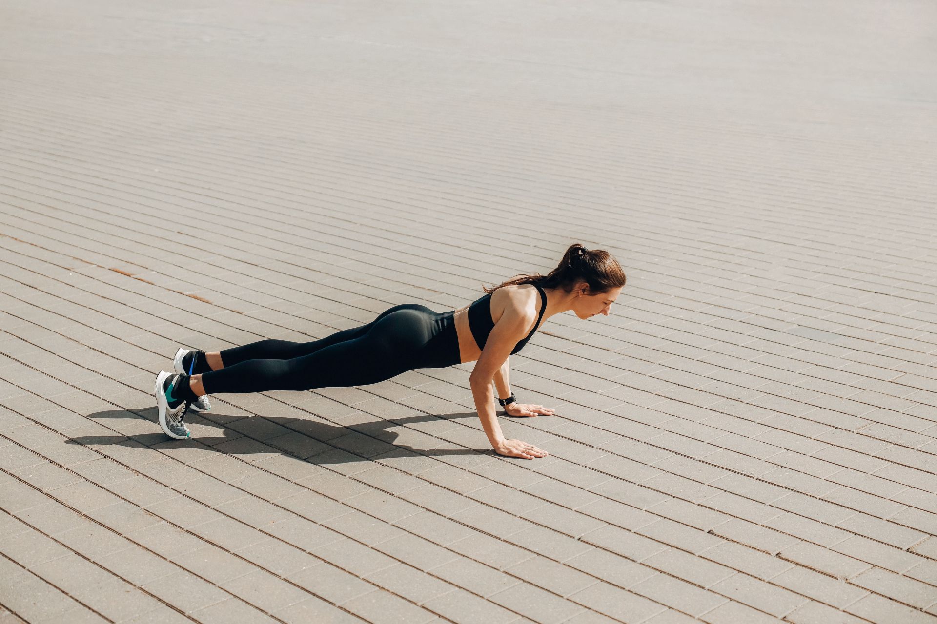 Sprawls are a great alternative of burpees that will also be easy on your lower back (Image via Pexels @Maksim Goncharenok)