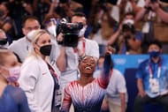 Simone Biles of Team United States and coach Cecile Landi