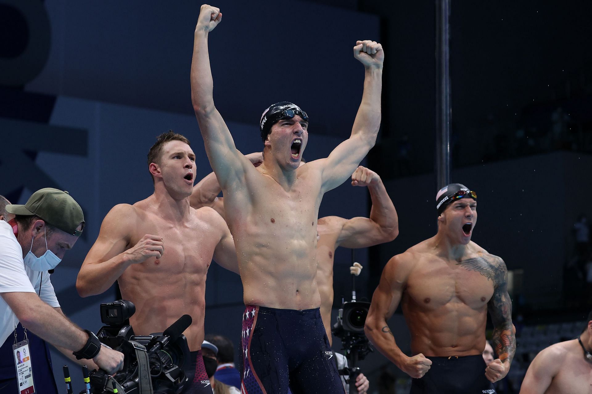 Zach Apple (C) and teammates of Team United States react after winning the gold medal and breaking the world record in the Men's 4 x 100m Medley Relay Final on day nine of the Tokyo 2020 Olympic Games (Photo by Al Bello/Getty Images)