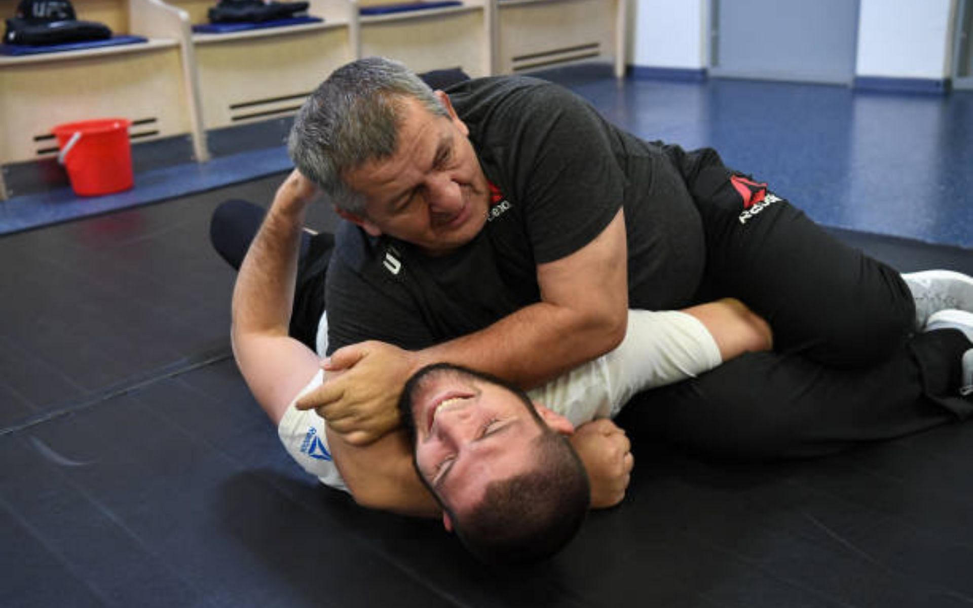 Khabib Nurmagomedov and Abdulmanap Nurmagomedov [image courtesy of Mike Roach/Zuffa LLC via Getty Images]