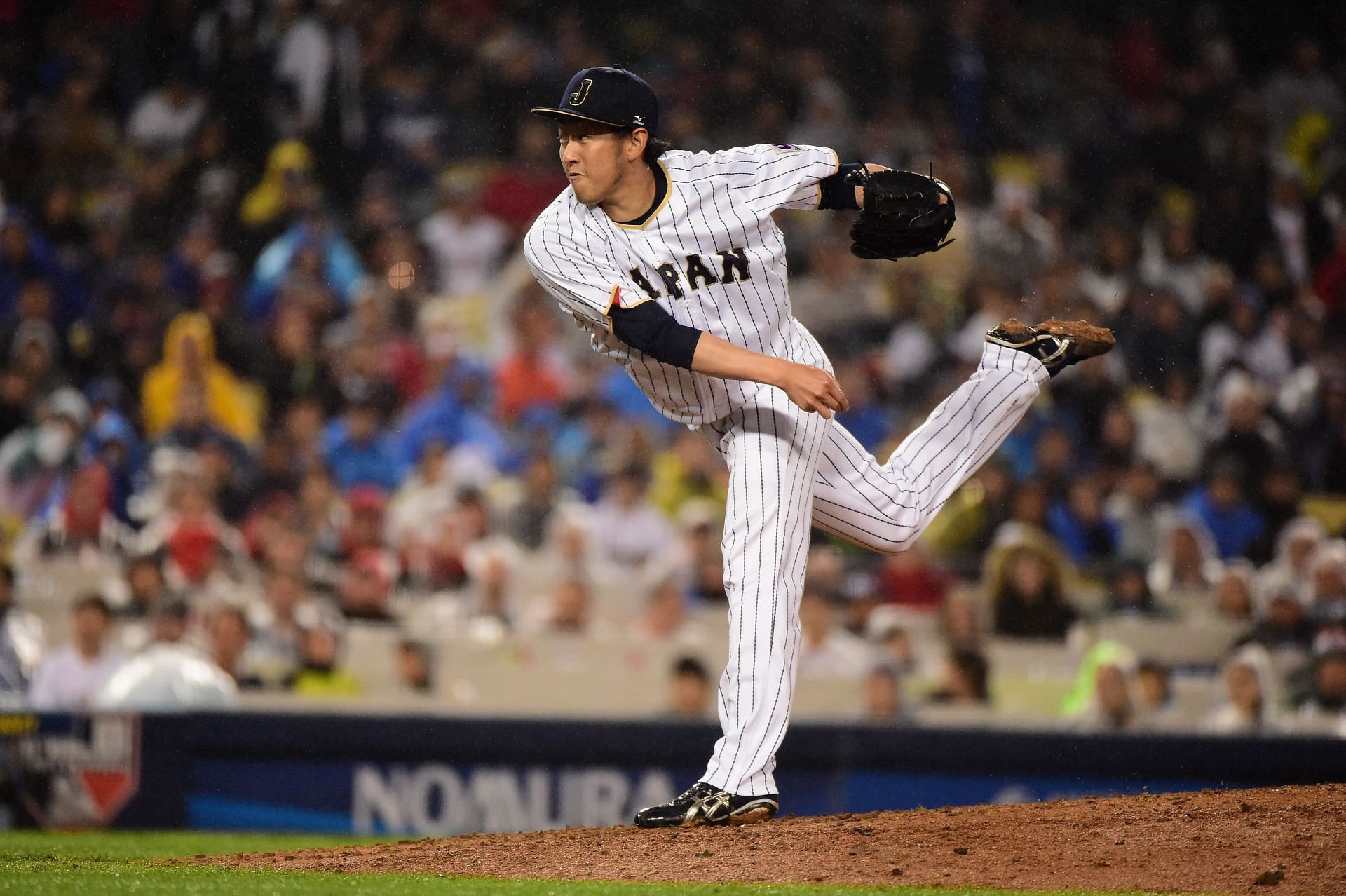 Yoshihisa Hirano of Japan pitches in the ninth inning against the United States.