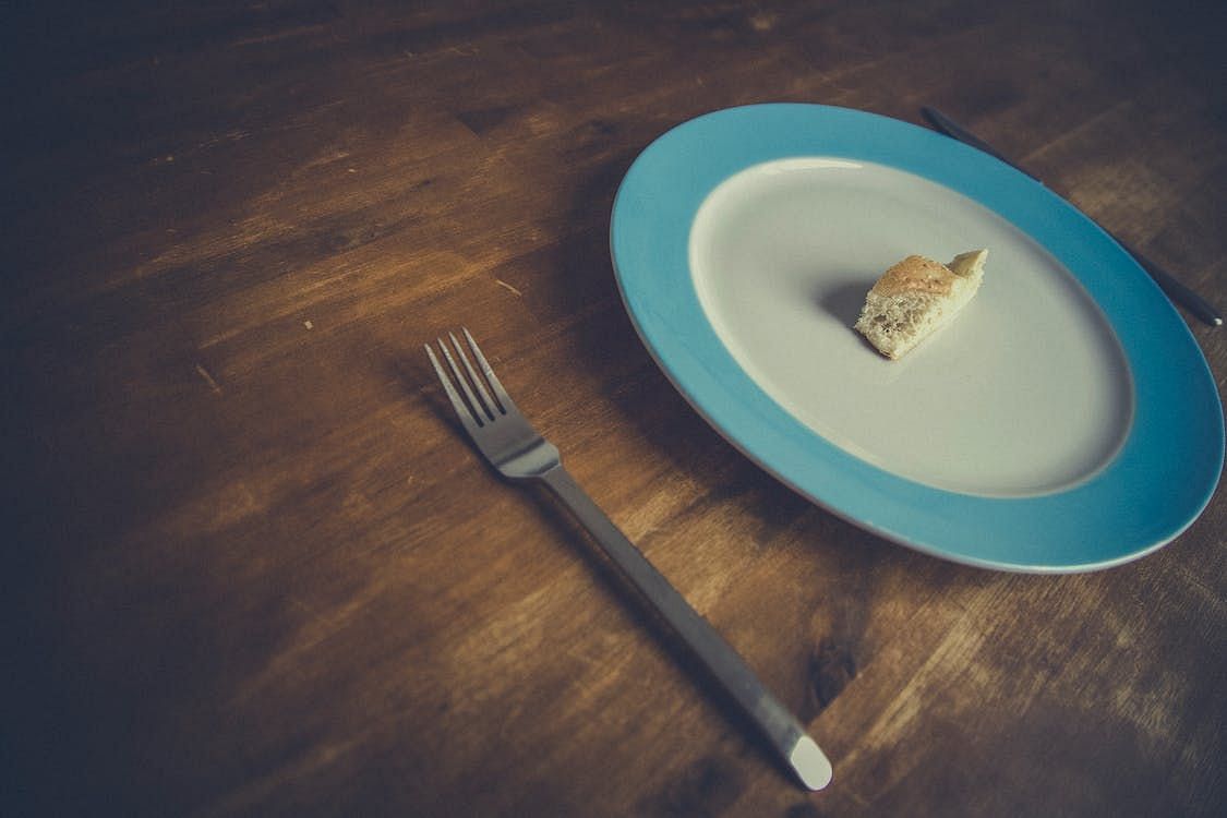 Change in eating habits, such as skipping meals (Image via Pexels/Markus Spiske)