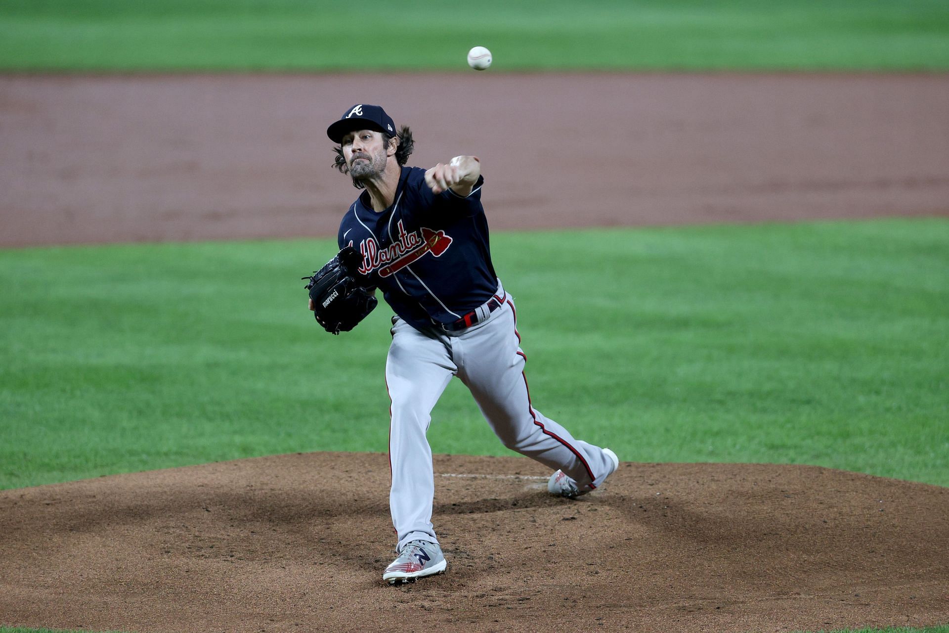 Starting pitcher Cole Hamels #32 of the Atlanta Braves throws to a Baltimore Orioles batter