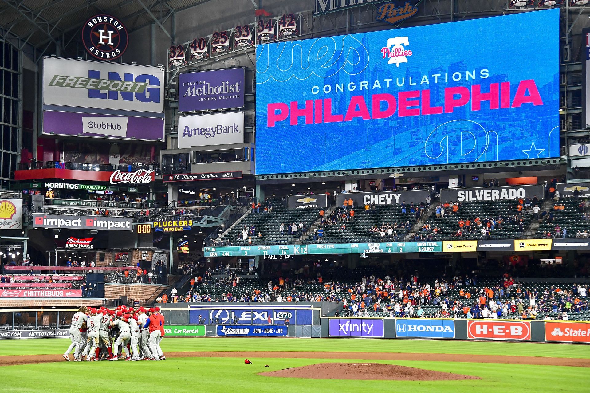 The Philadelphia Phillies celebrate after clinching the Wild Card with a 3-0 win over the Houston Astros at Minute Maid Park (Photo by Logan Riely/Getty Images)