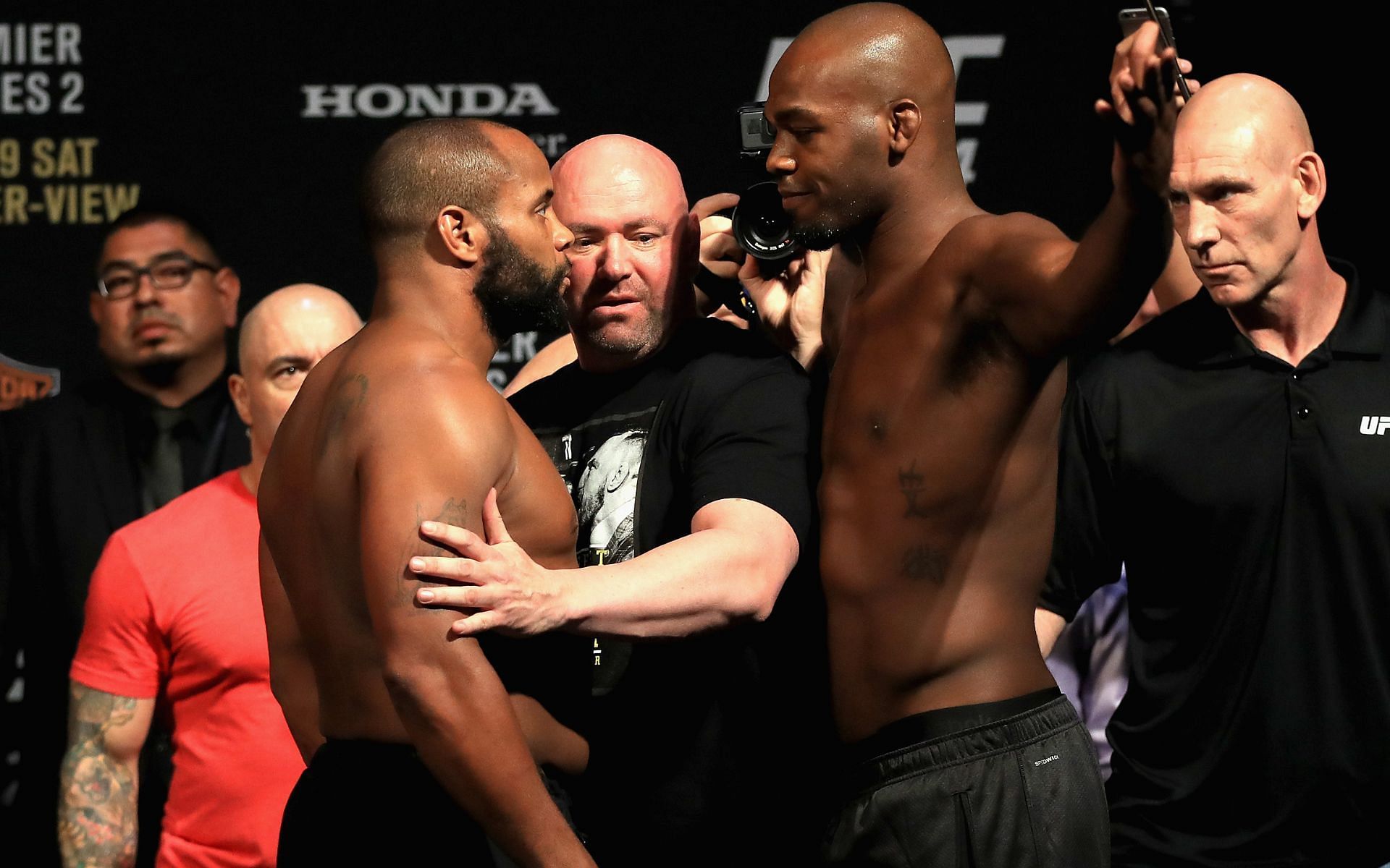 Daniel Cormier (left), Jon Jones (right)