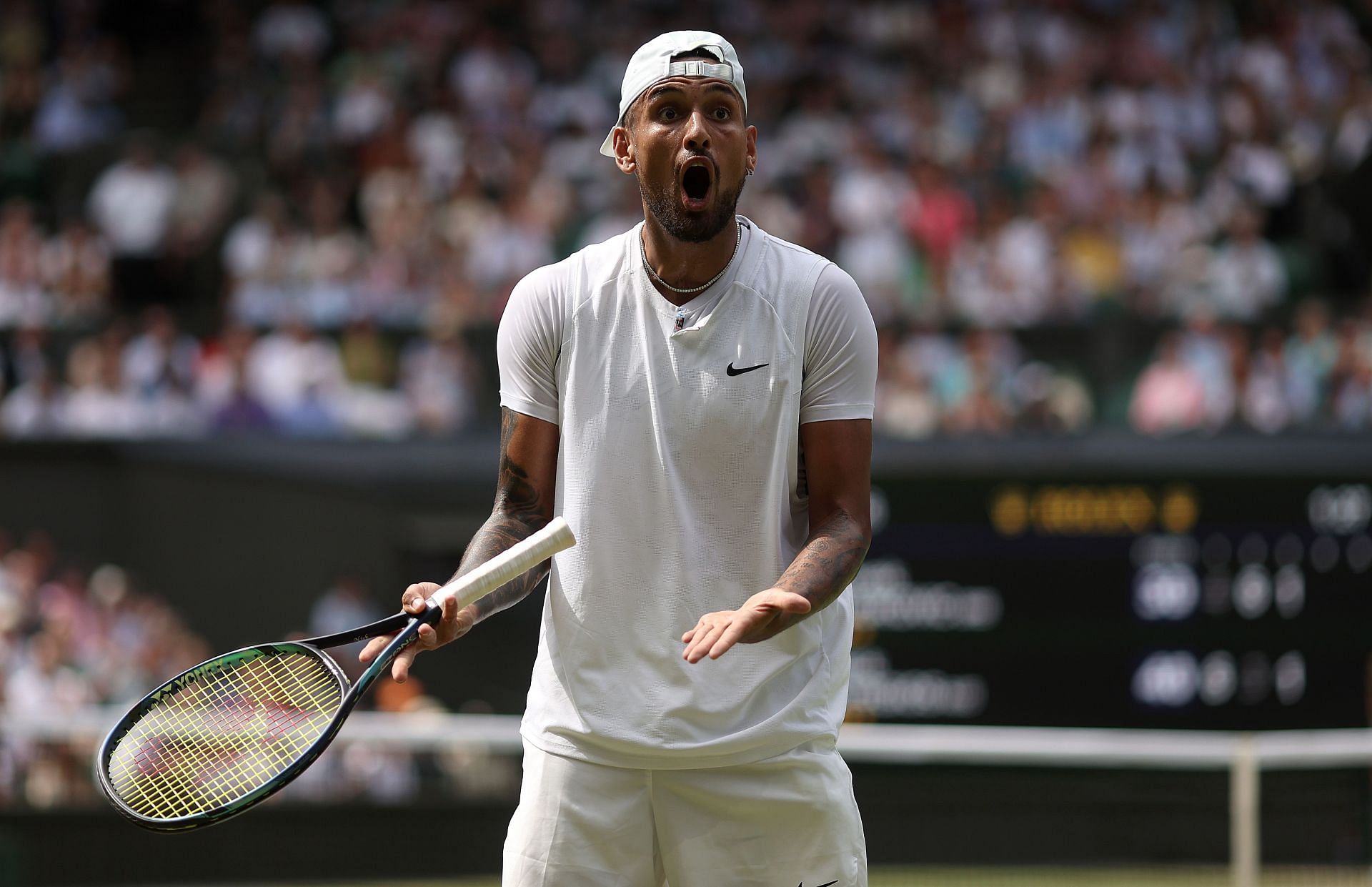 Nick Kyrgios reacts angrily in his match against Novak Djokovic