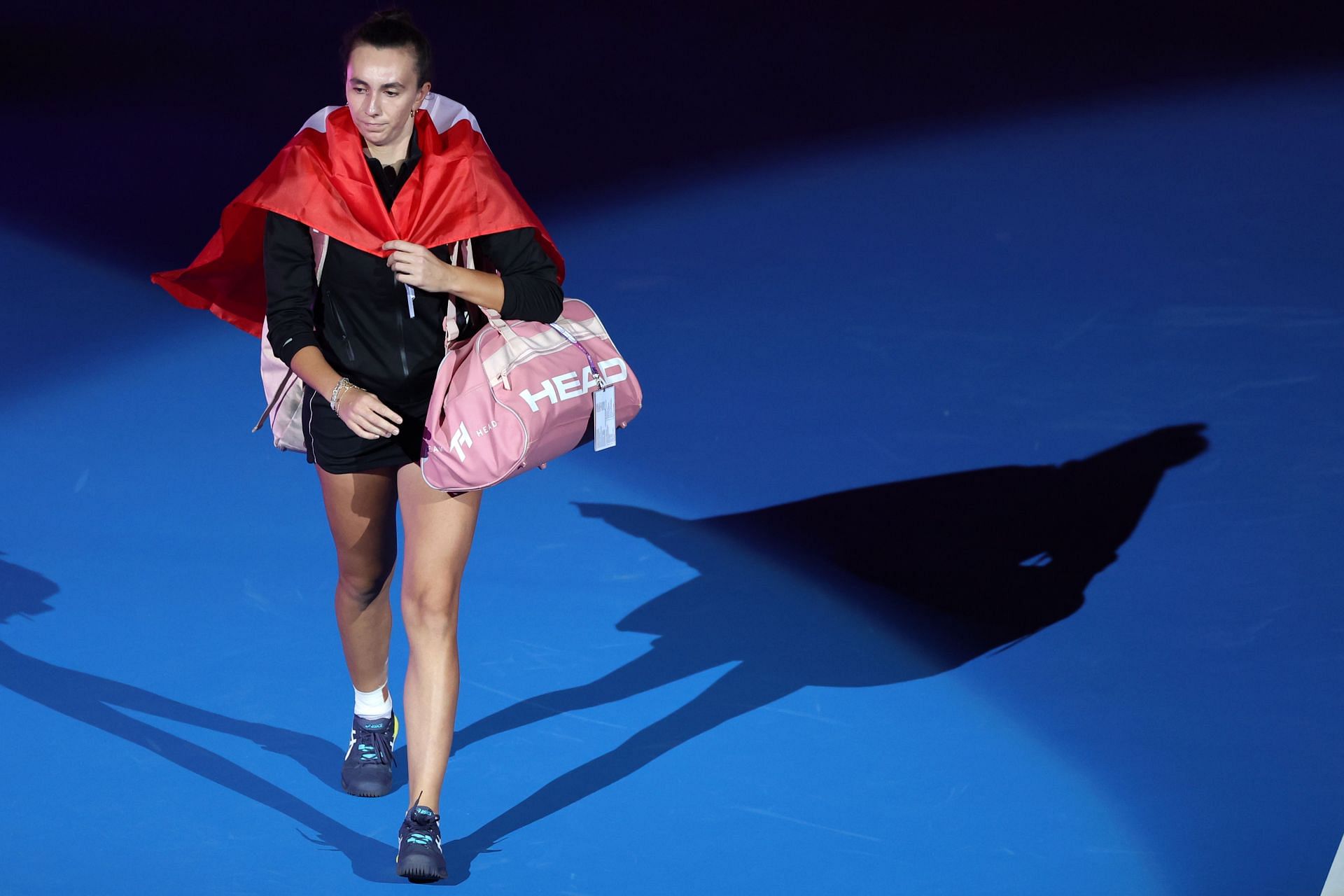 Ipek Oz walks out on the court with the Turkish flag at the Qatar Open.