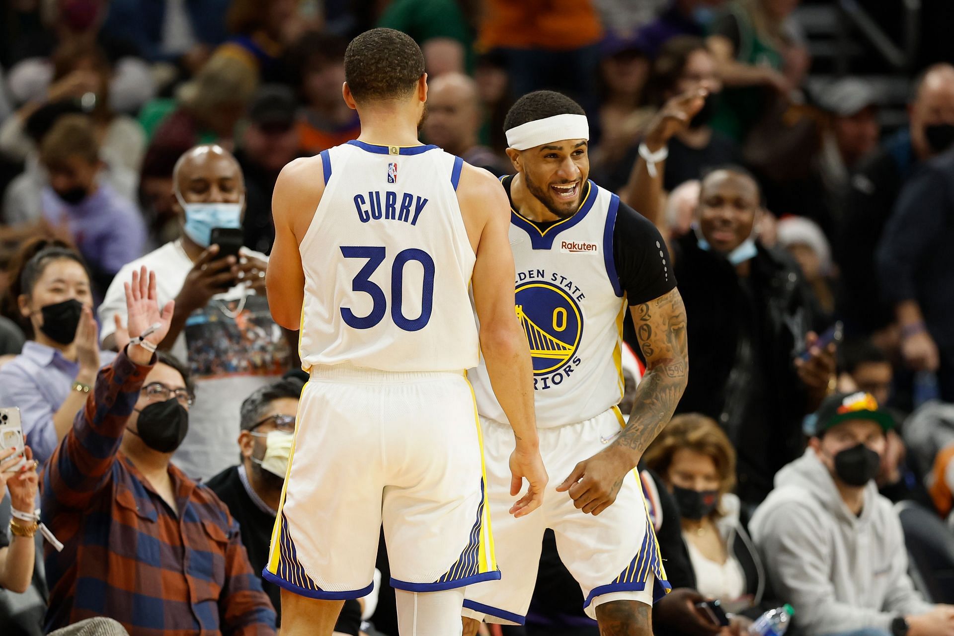 Gary Payton II of the Golden State Warriors celebrates with Steph Curry.