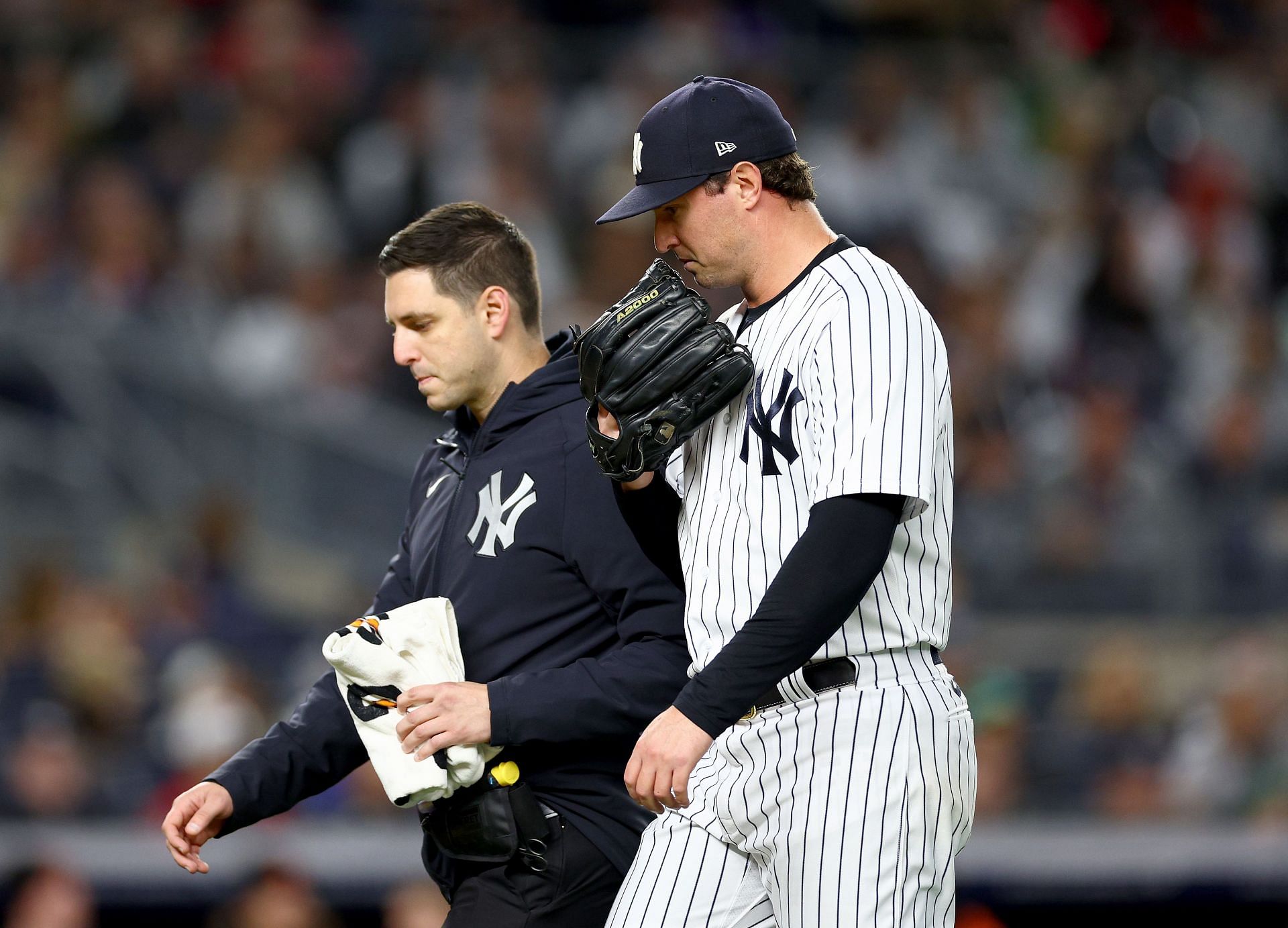 Zack Britton #53 of the New York Yankees walks off the field after he is puled in the sixth inning