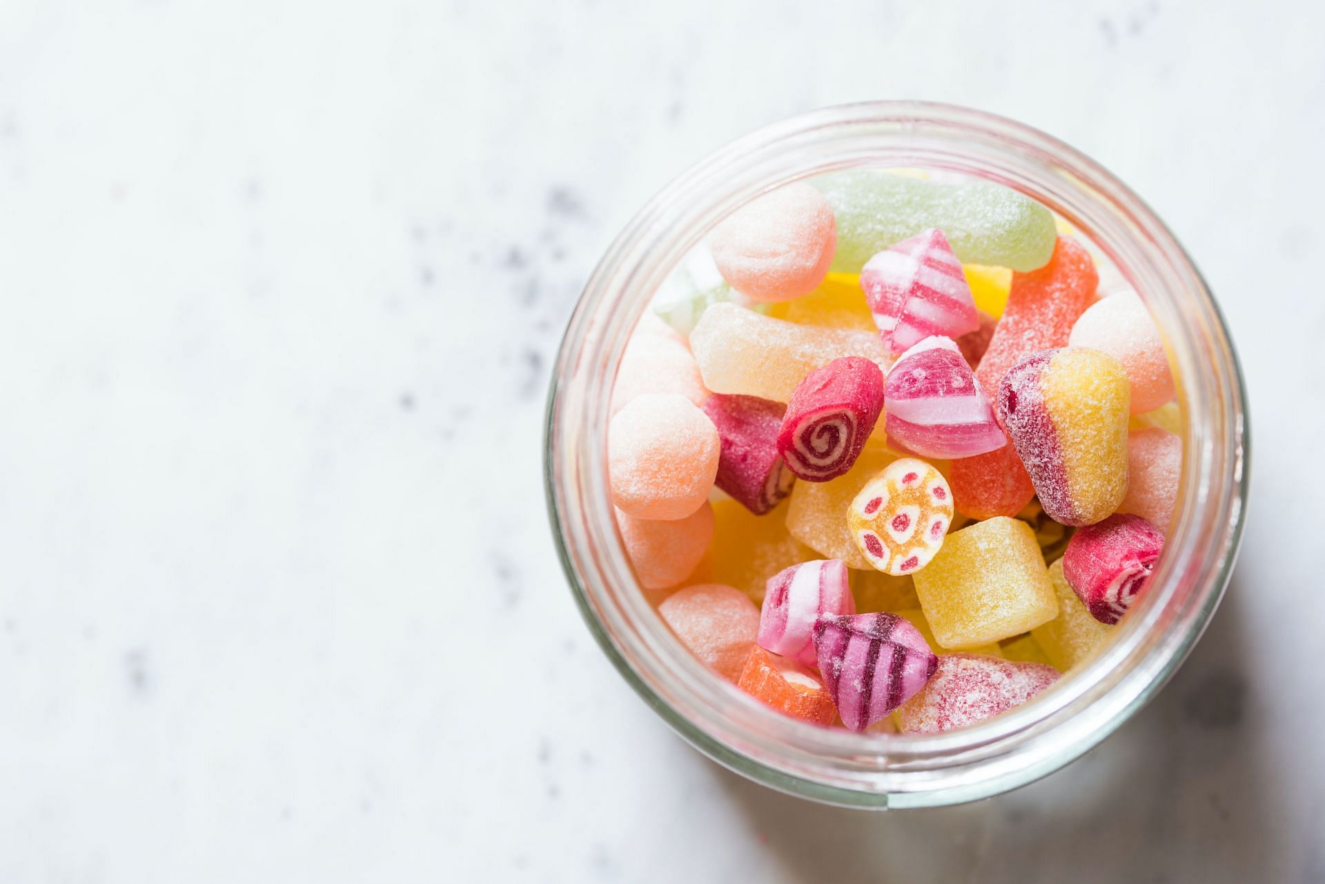 We consume sugar in many ways, like candies. (Image via Unsplash/ Joanna Kosinska)