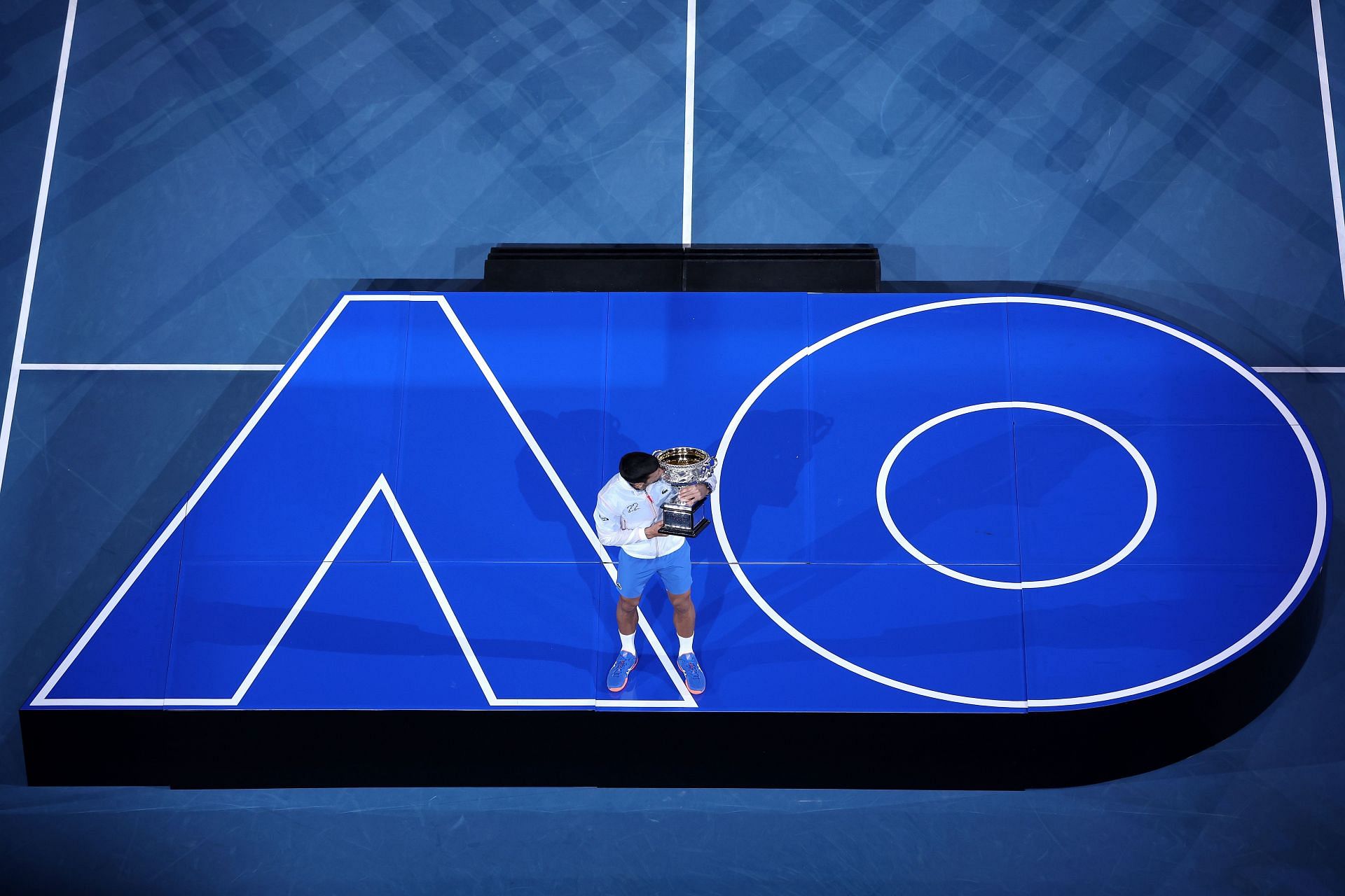 Novak Djokovic with the trophy at the 2023 Australian Open