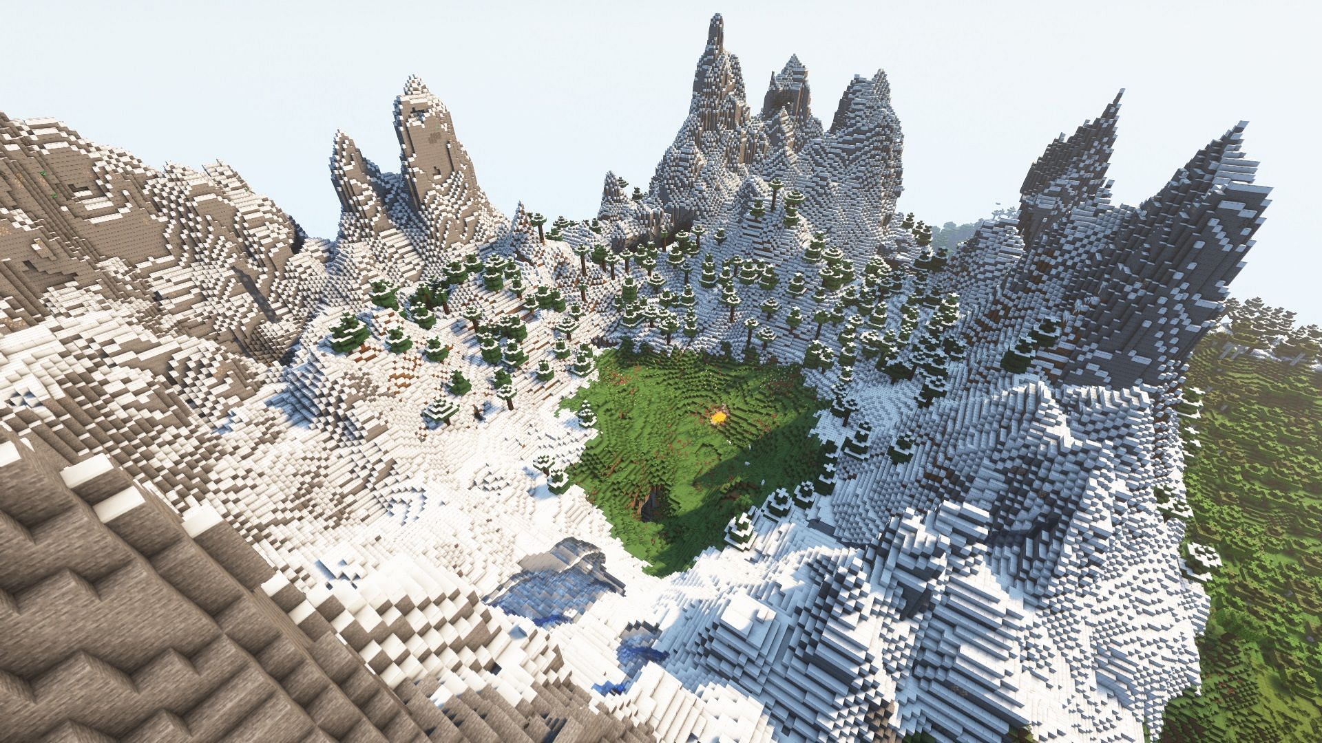 Small plains biome area surrounded by tall mountains (Image via Mojang)